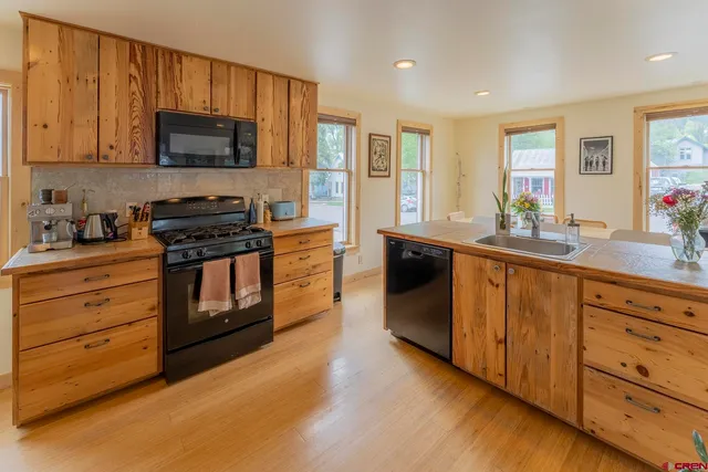 a spacious bedroom with a bed and a window