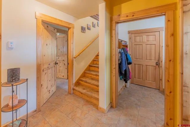 a large kitchen with stainless steel appliances granite countertop a large window and a sink