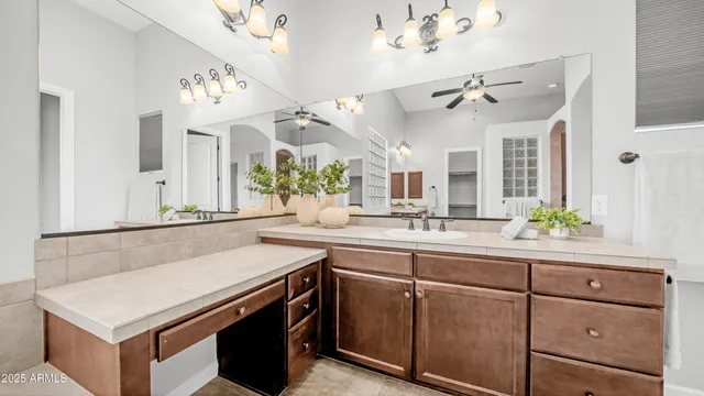 a spacious bedroom with a bed and a painting on the wall