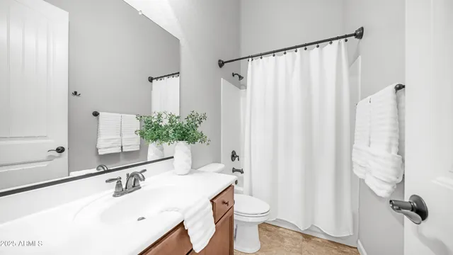 a view of a house with swimming pool and sitting area