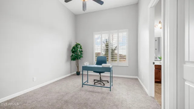 a view of a patio with table and chairs and potted plants