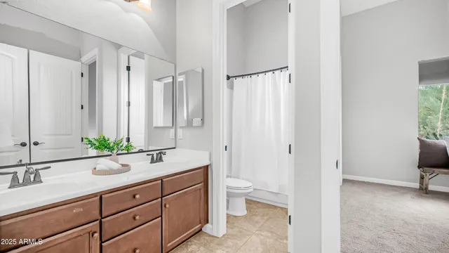 a view of a patio with a table and chairs under an umbrella
