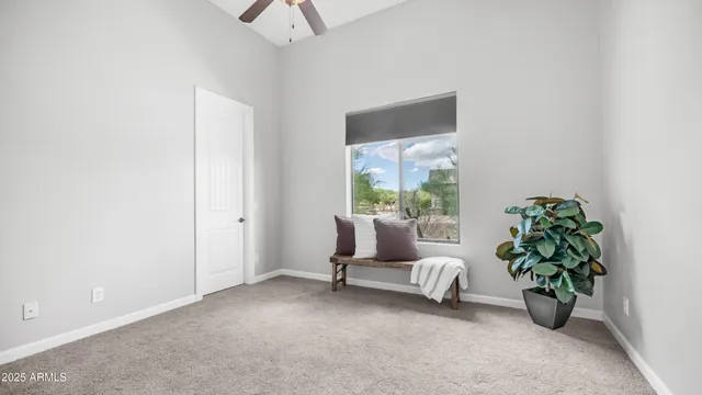a living room with furniture a rug and a chandelier
