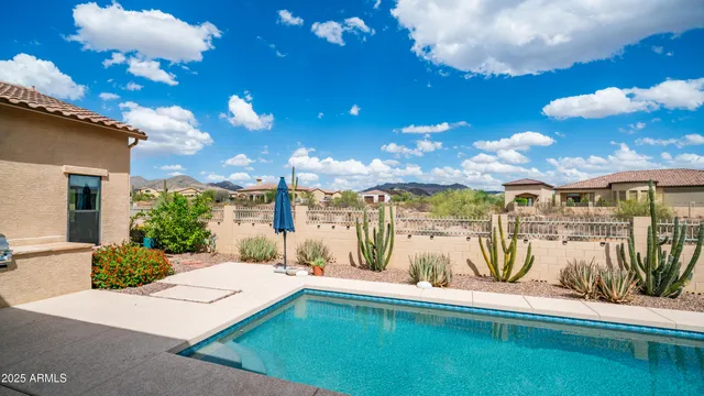 an aerial view of a houses with a city street