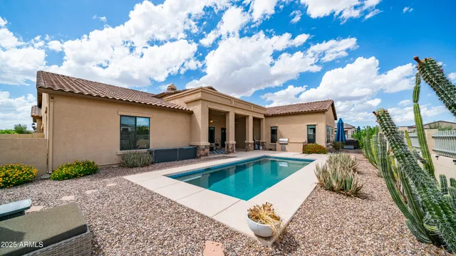 a view of a swimming pool with a patio
