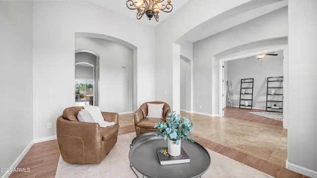 a kitchen with stainless steel appliances granite countertop a sink a stove and a wooden cabinets