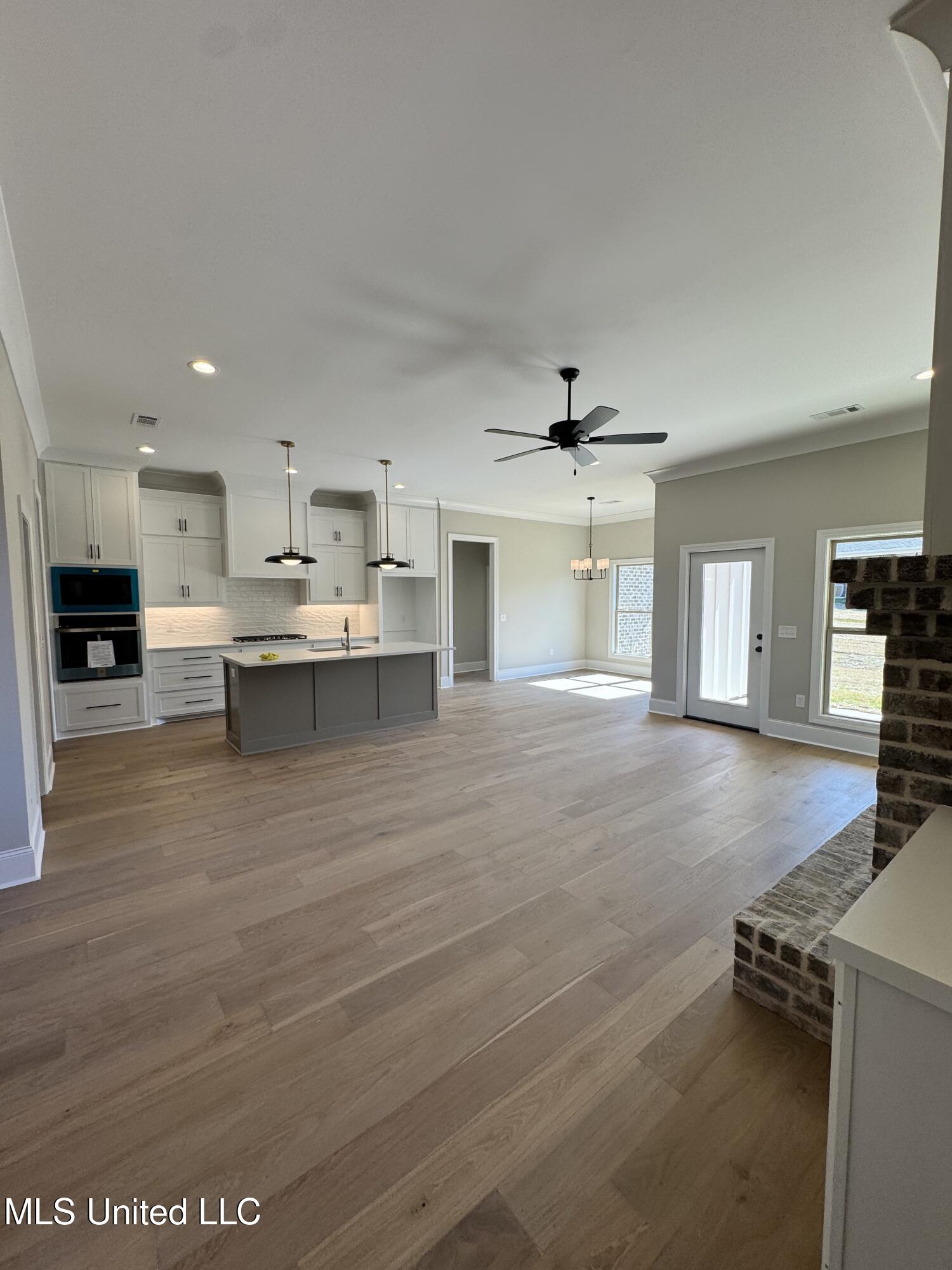 115 Southern Oak Way Canton, MS 39046 - Photo 32 of 32 115 living, kitchen and dining