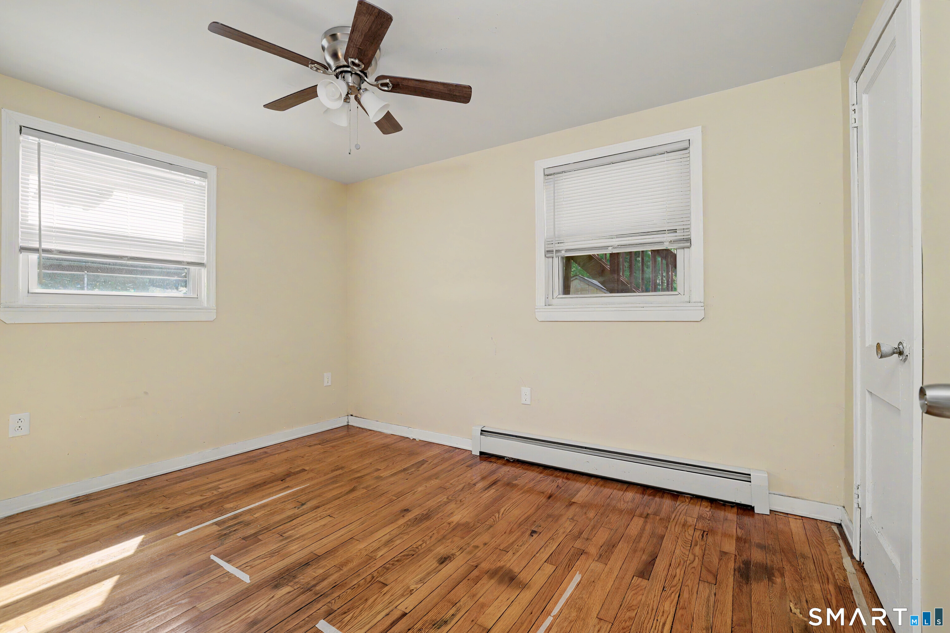 97 Boothbay Street Bloomfield, CT 06002 - Photo 21 of 33 a view of a room with wooden floor and a ceiling fan
