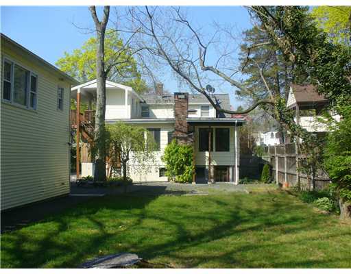 12 Salem Street Cos Cob, CT 06807 - Photo 2 of 5 a front view of a house with a yard