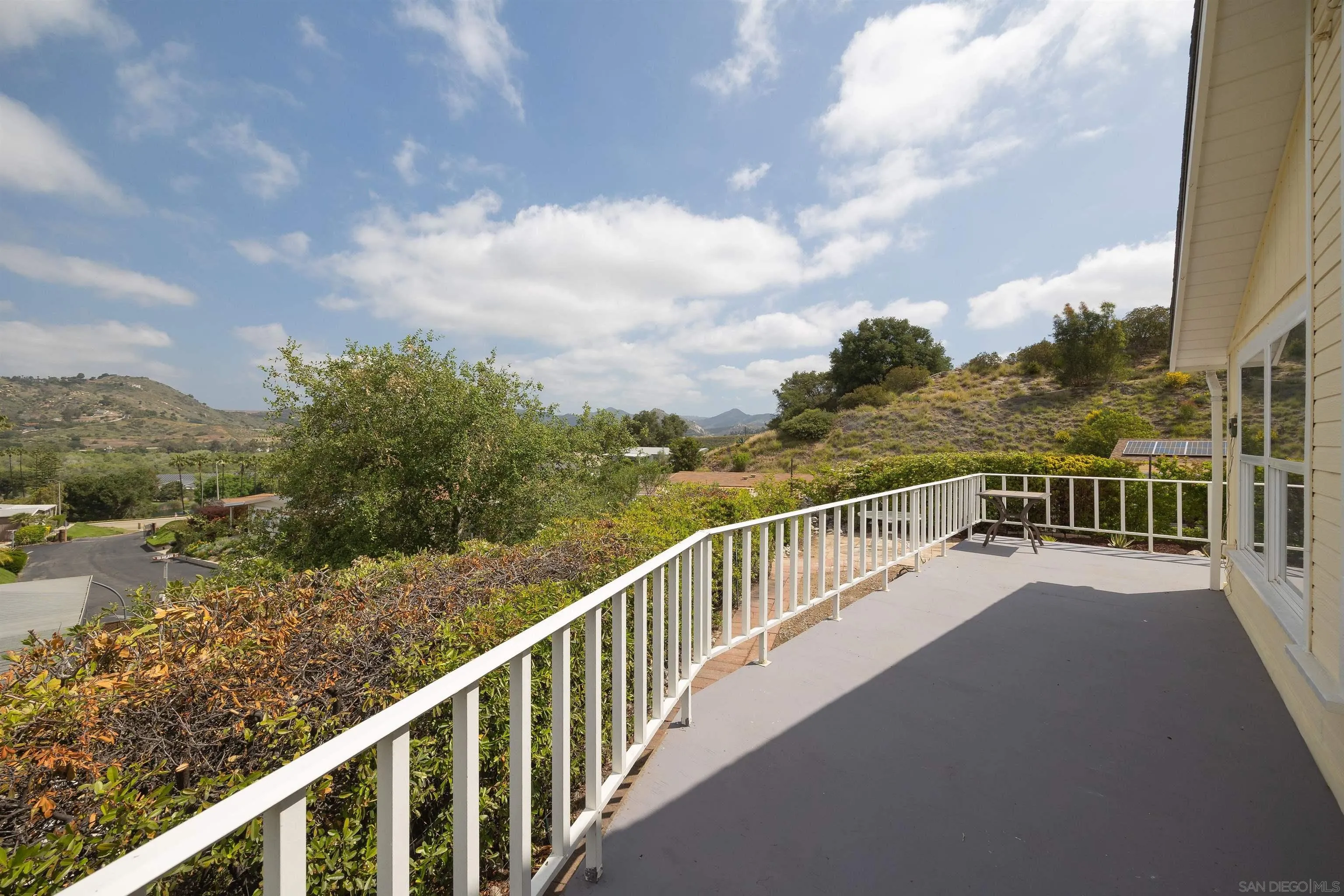 a view of a lake from a balcony