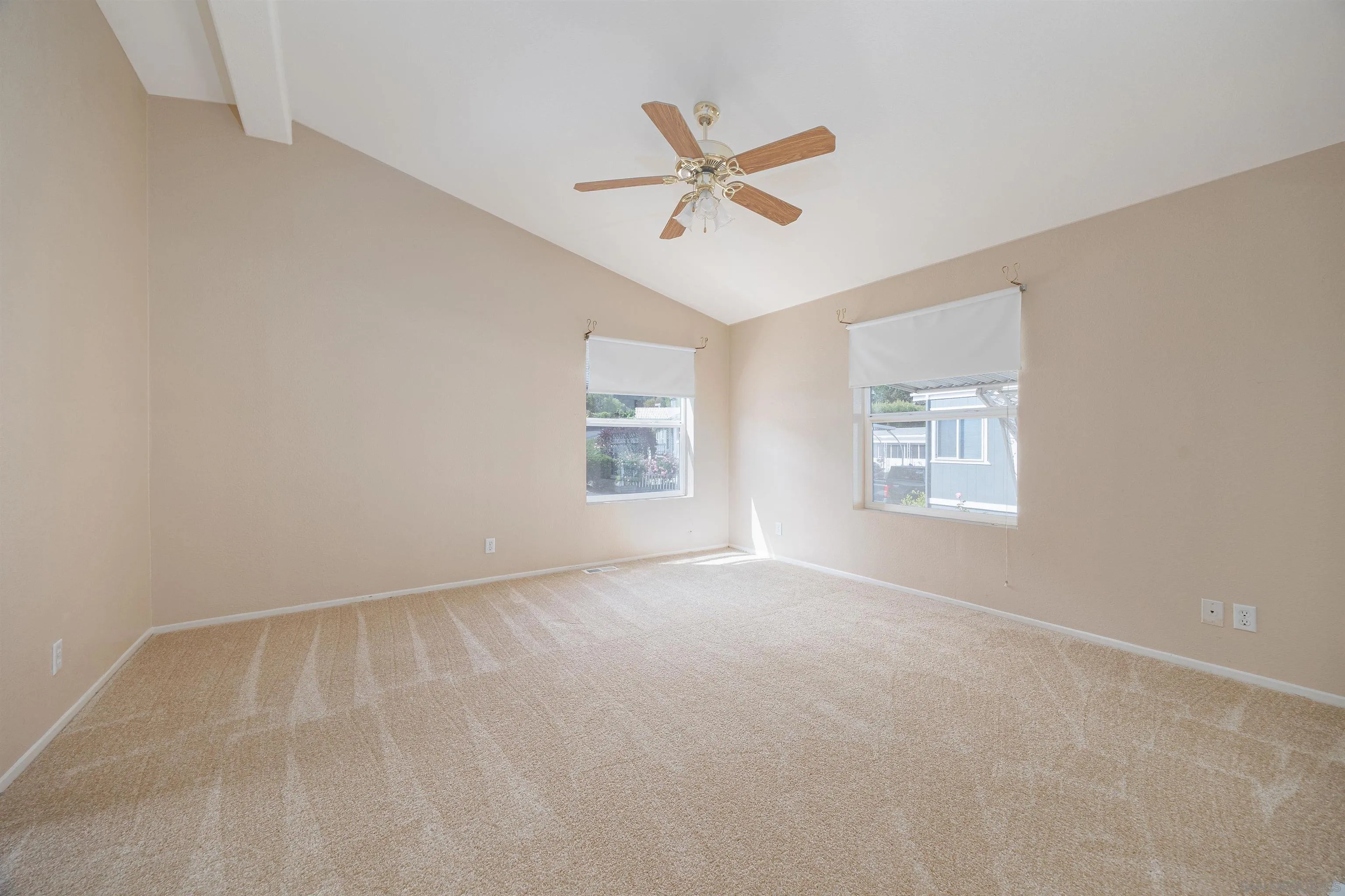 4650 Dulin Road, Unit 162 Fallbrook, CA 92003 - Photo 15 of 36 an empty room with windows and fan