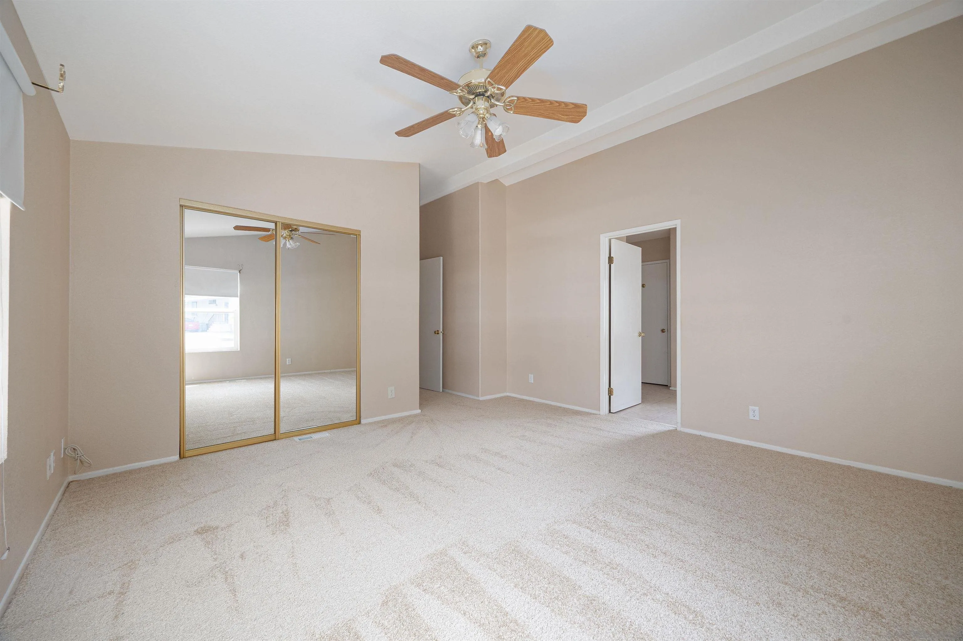 4650 Dulin Road, Unit 162 Fallbrook, CA 92003 - Photo 16 of 36 an empty room with fan and windows