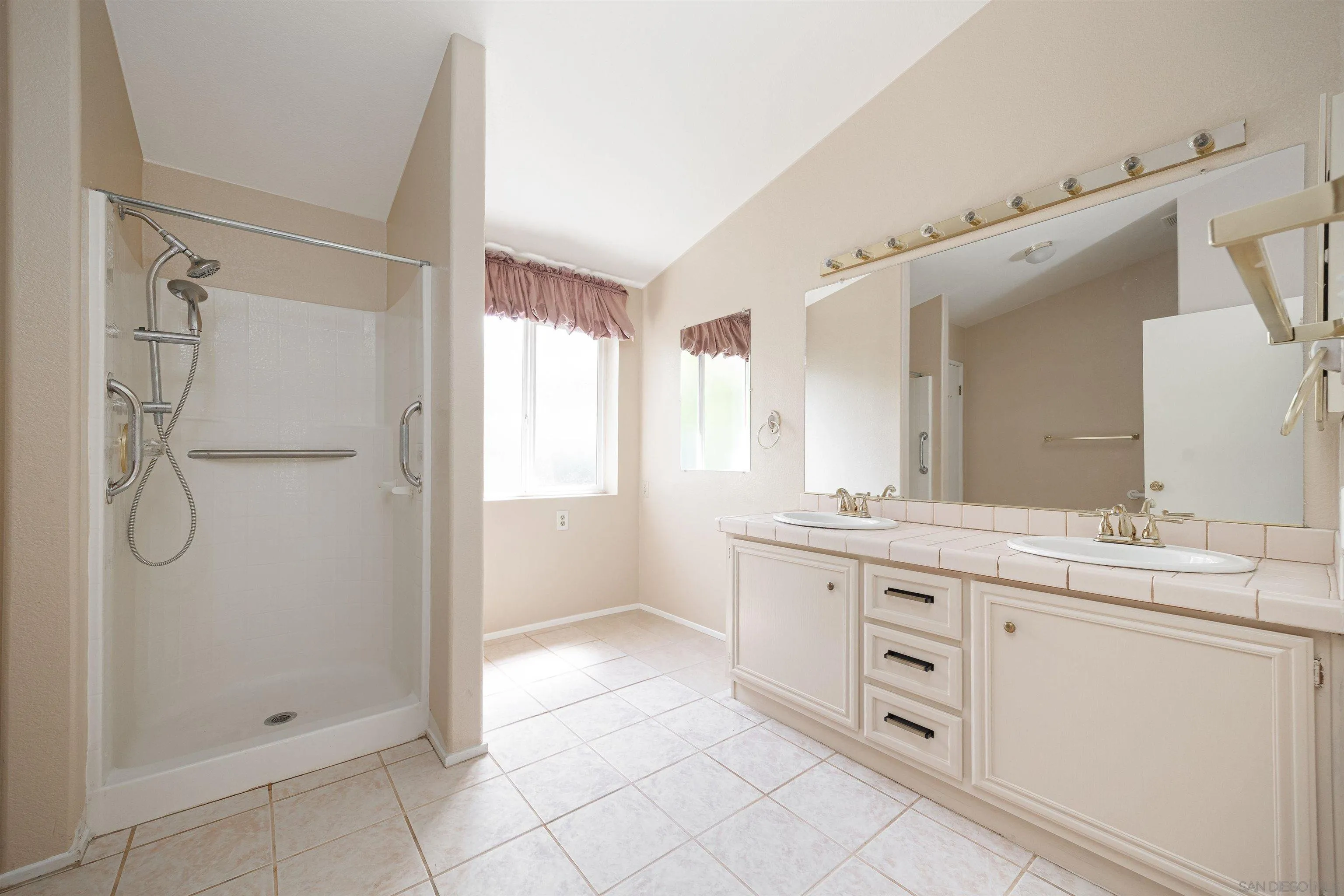 4650 Dulin Road, Unit 162 Fallbrook, CA 92003 - Photo 17 of 36 a spacious bathroom with a double vanity sink mirror and double