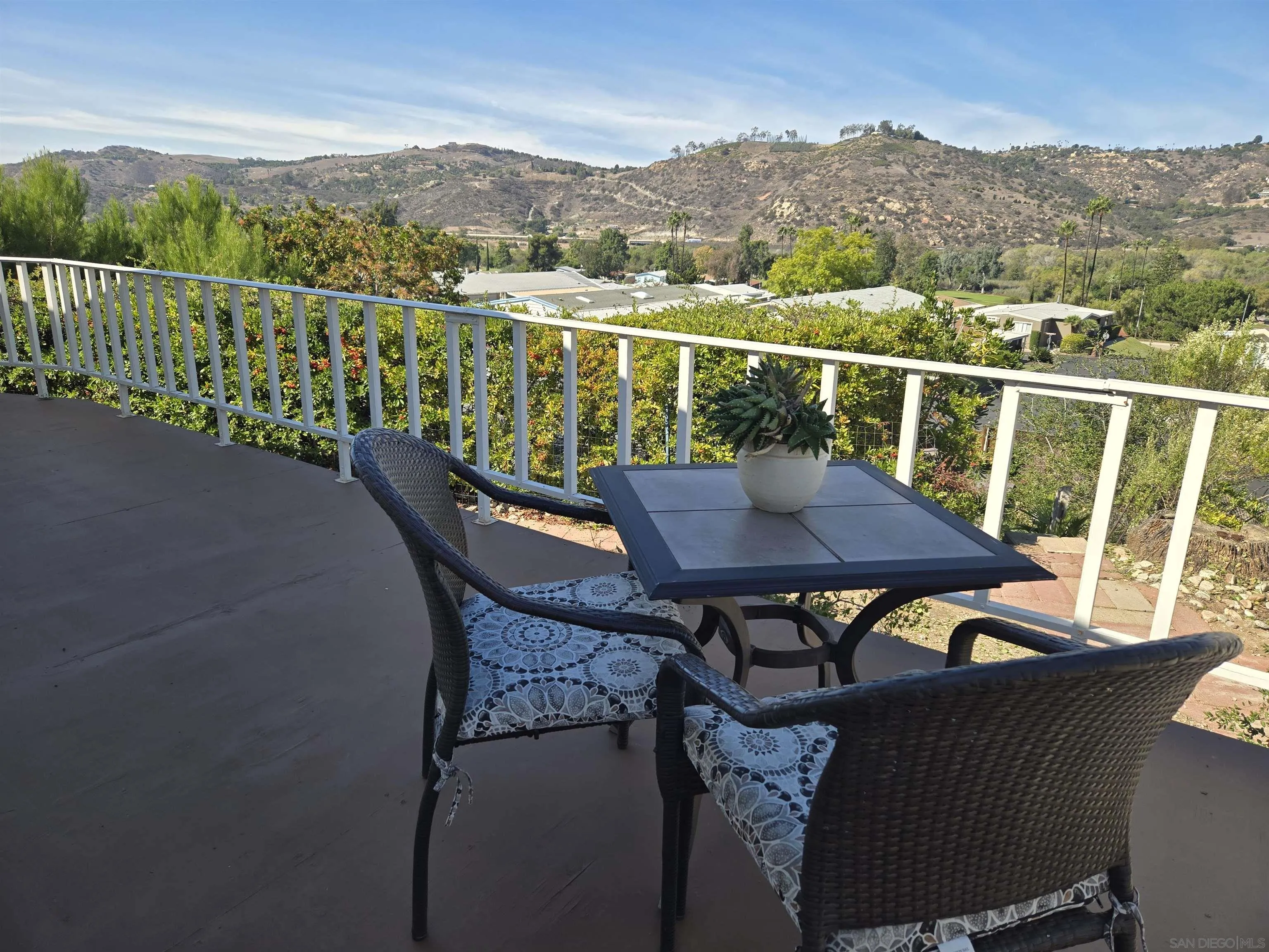 4650 Dulin Road, Unit 162 Fallbrook, CA 92003 - Photo 18 of 36 a view of a chairs and table on the terrace