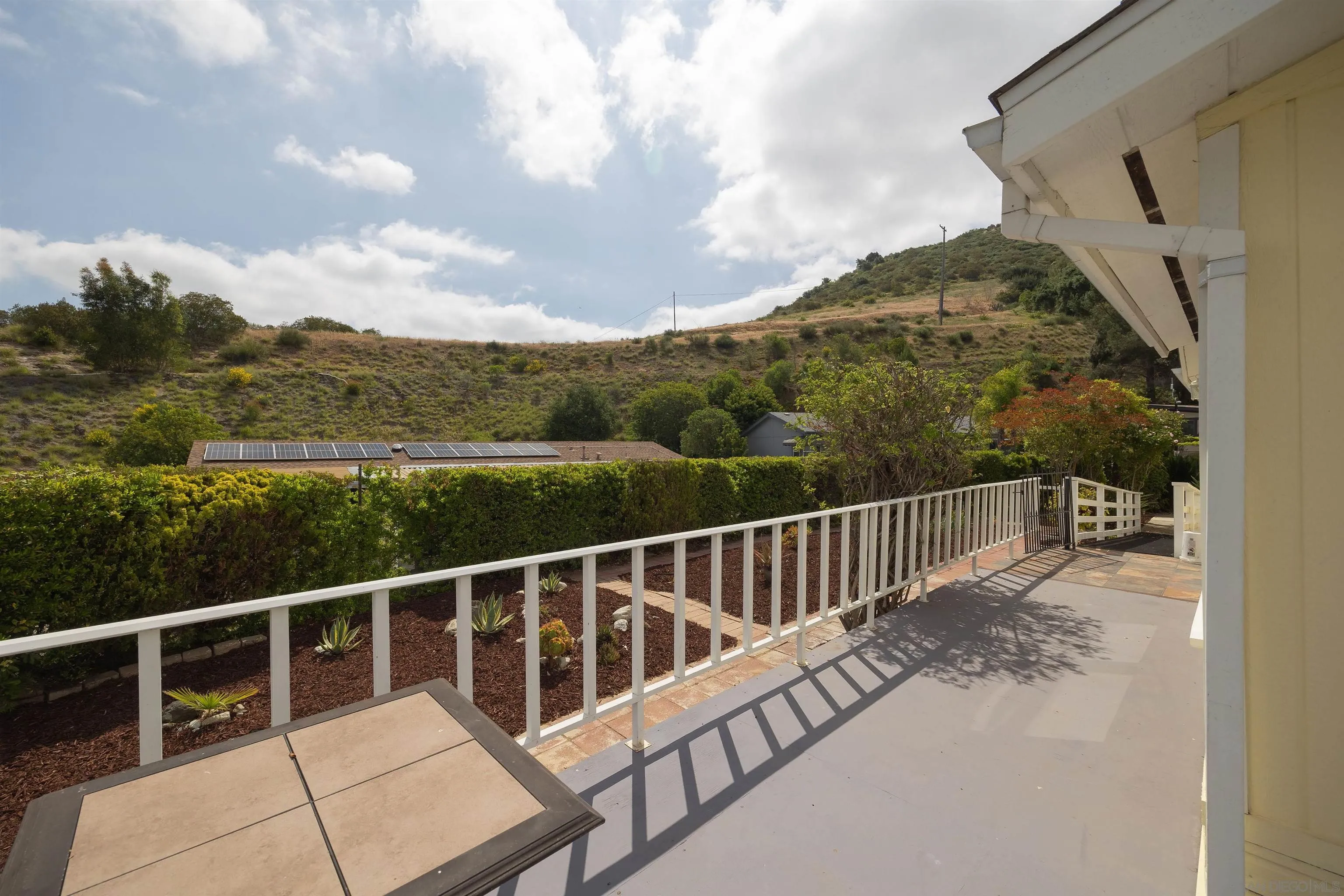 4650 Dulin Road, Unit 162 Fallbrook, CA 92003 - Photo 19 of 36 a view of a balcony with floor to ceiling windows
