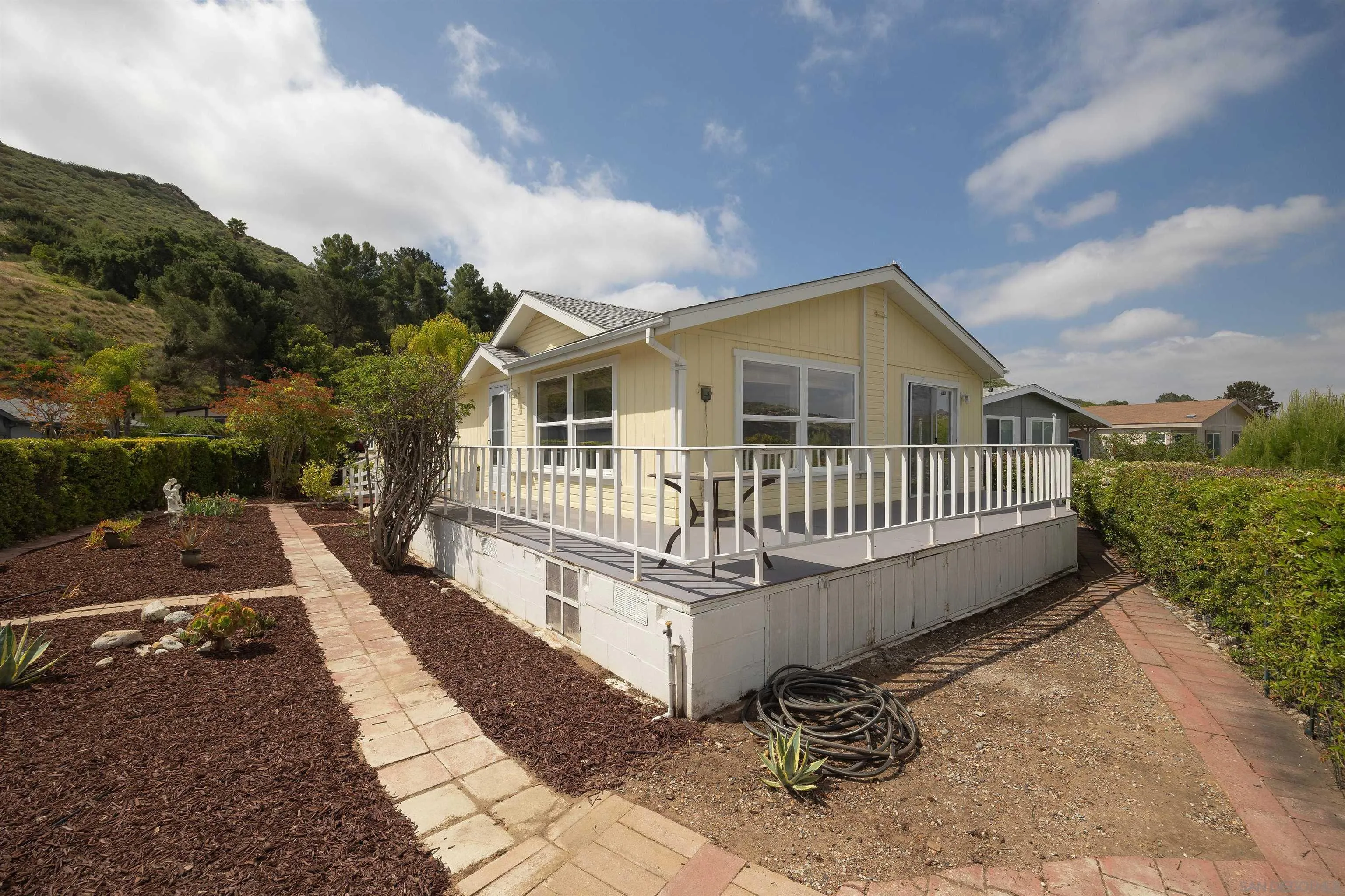 4650 Dulin Road, Unit 162 Fallbrook, CA 92003 - Photo 20 of 36 a view of a house with a roof deck