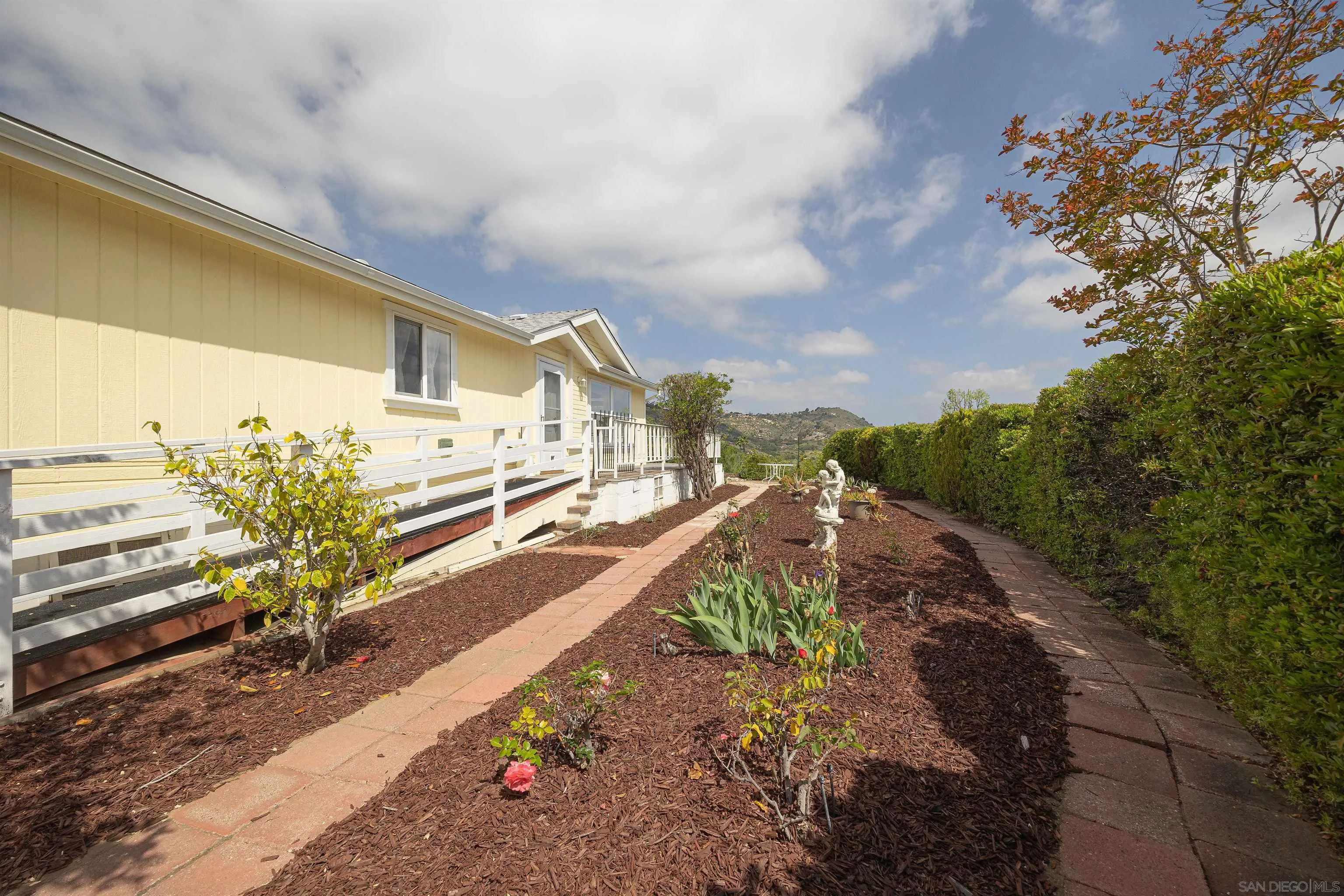 4650 Dulin Road, Unit 162 Fallbrook, CA 92003 - Photo 21 of 36 a view of a terrace with a garden
