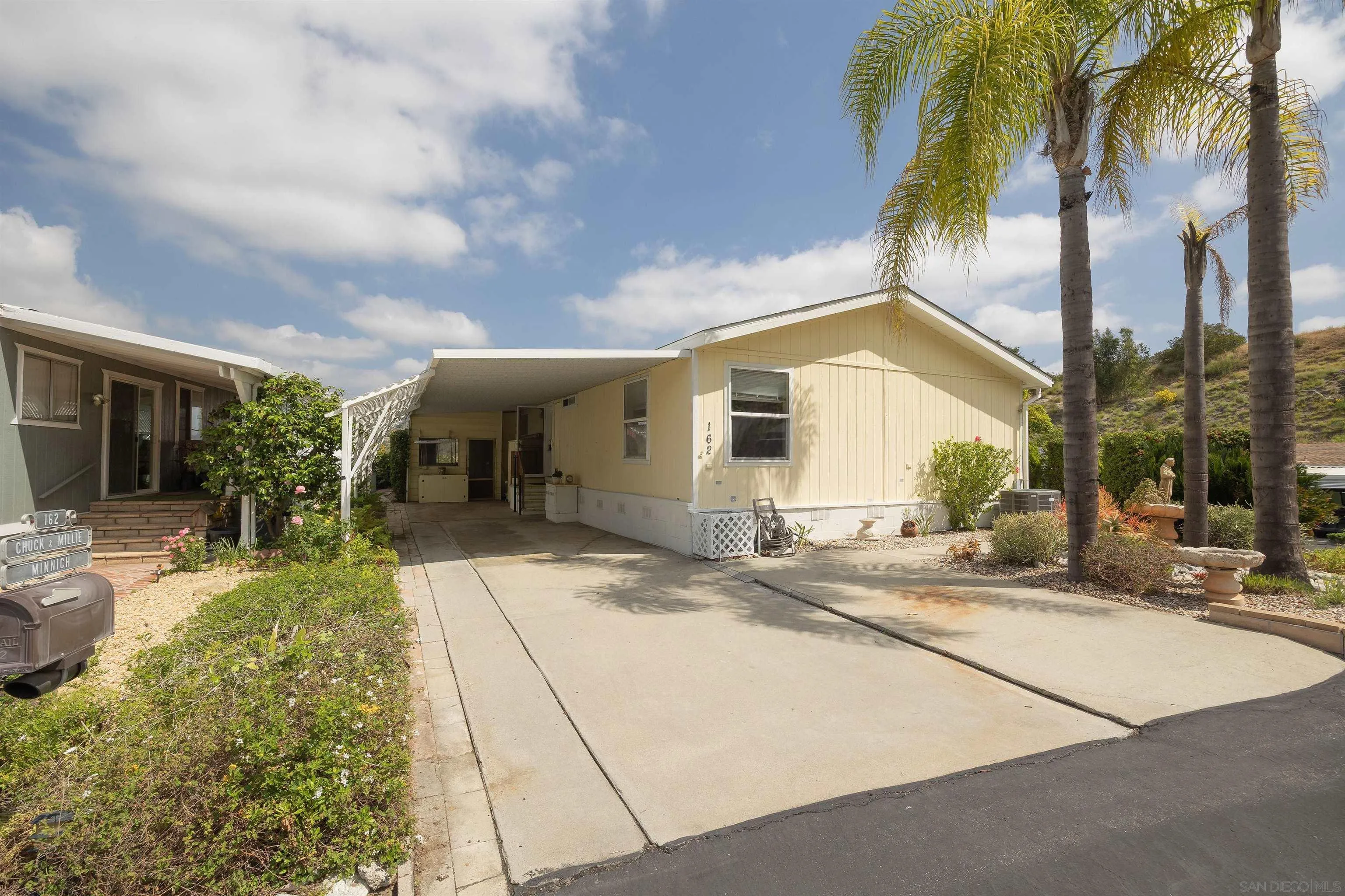 4650 Dulin Road, Unit 162 Fallbrook, CA 92003 - Photo 22 of 36 a view of a house with backyard and sitting area