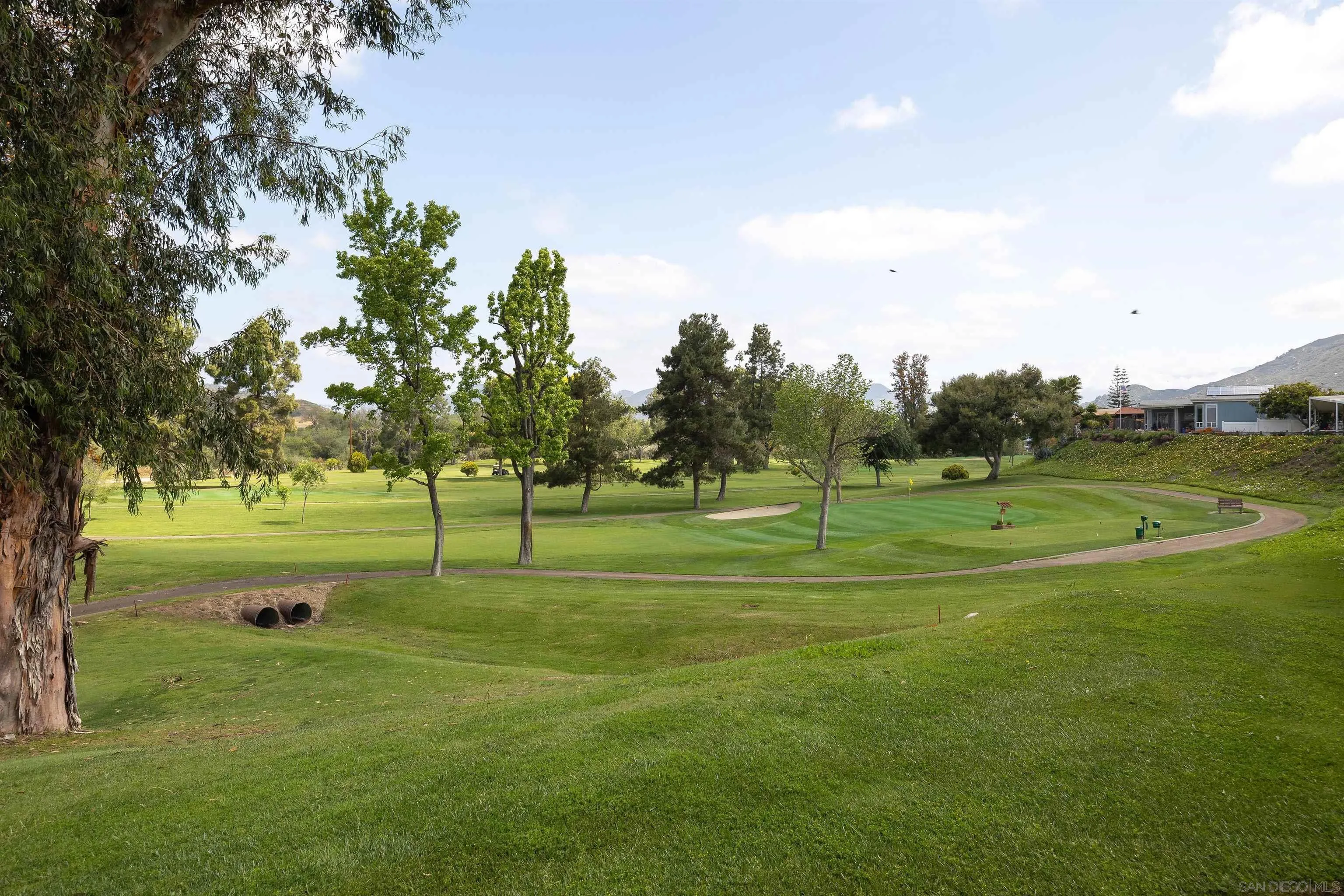 4650 Dulin Road, Unit 162 Fallbrook, CA 92003 - Photo 24 of 36 a view of a park with trees and grass