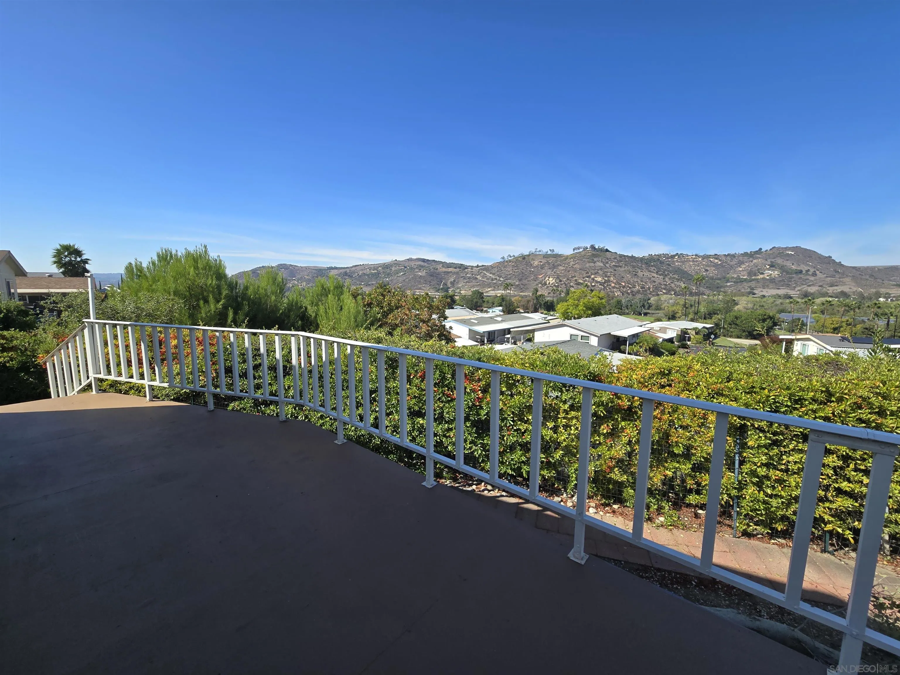 4650 Dulin Road, Unit 162 Fallbrook, CA 92003 - Photo 25 of 36 a view of city and mountain from a balcony