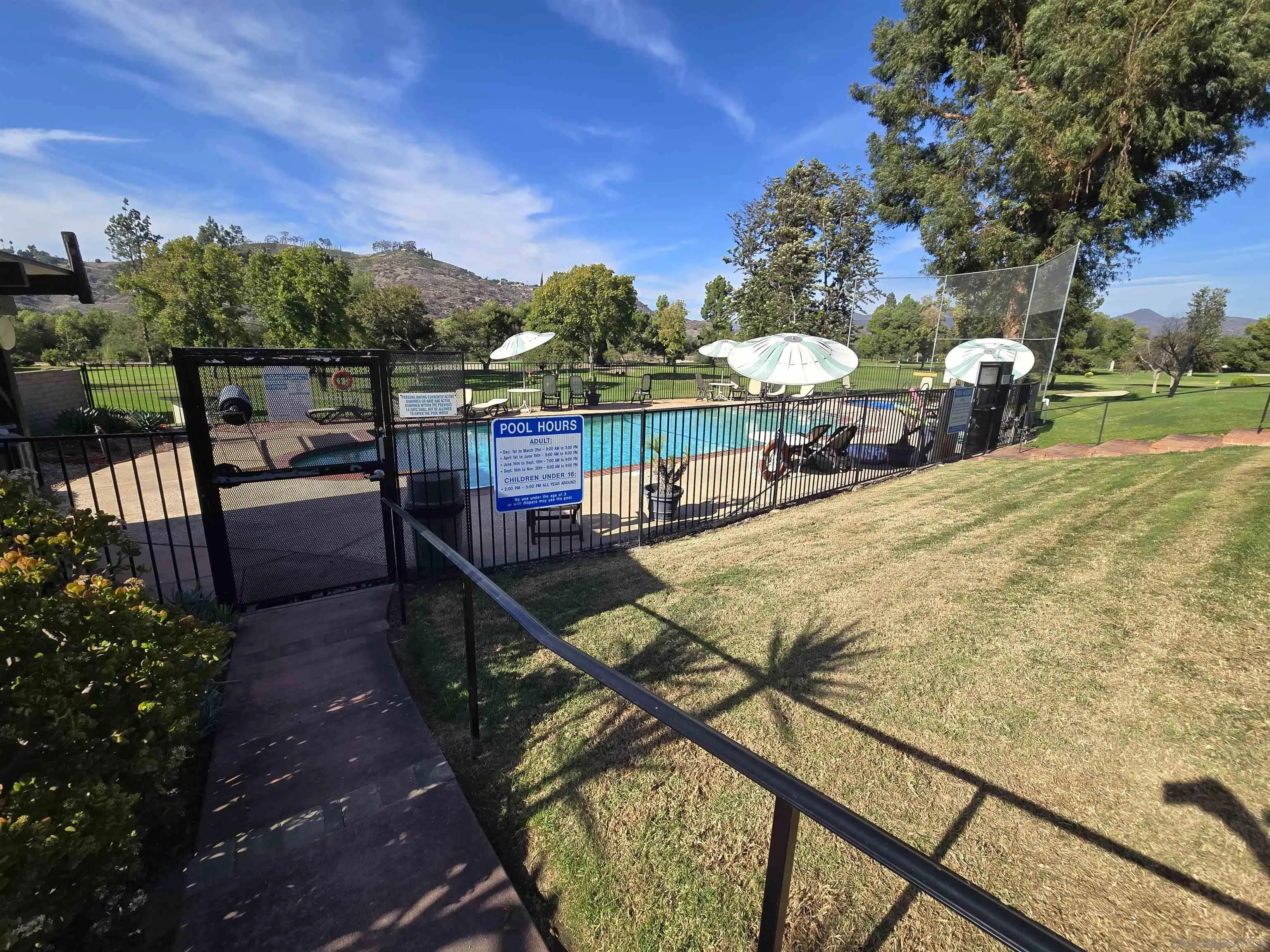 4650 Dulin Road, Unit 162 Fallbrook, CA 92003 - Photo 33 of 36 a view of a porch with furniture and a yard
