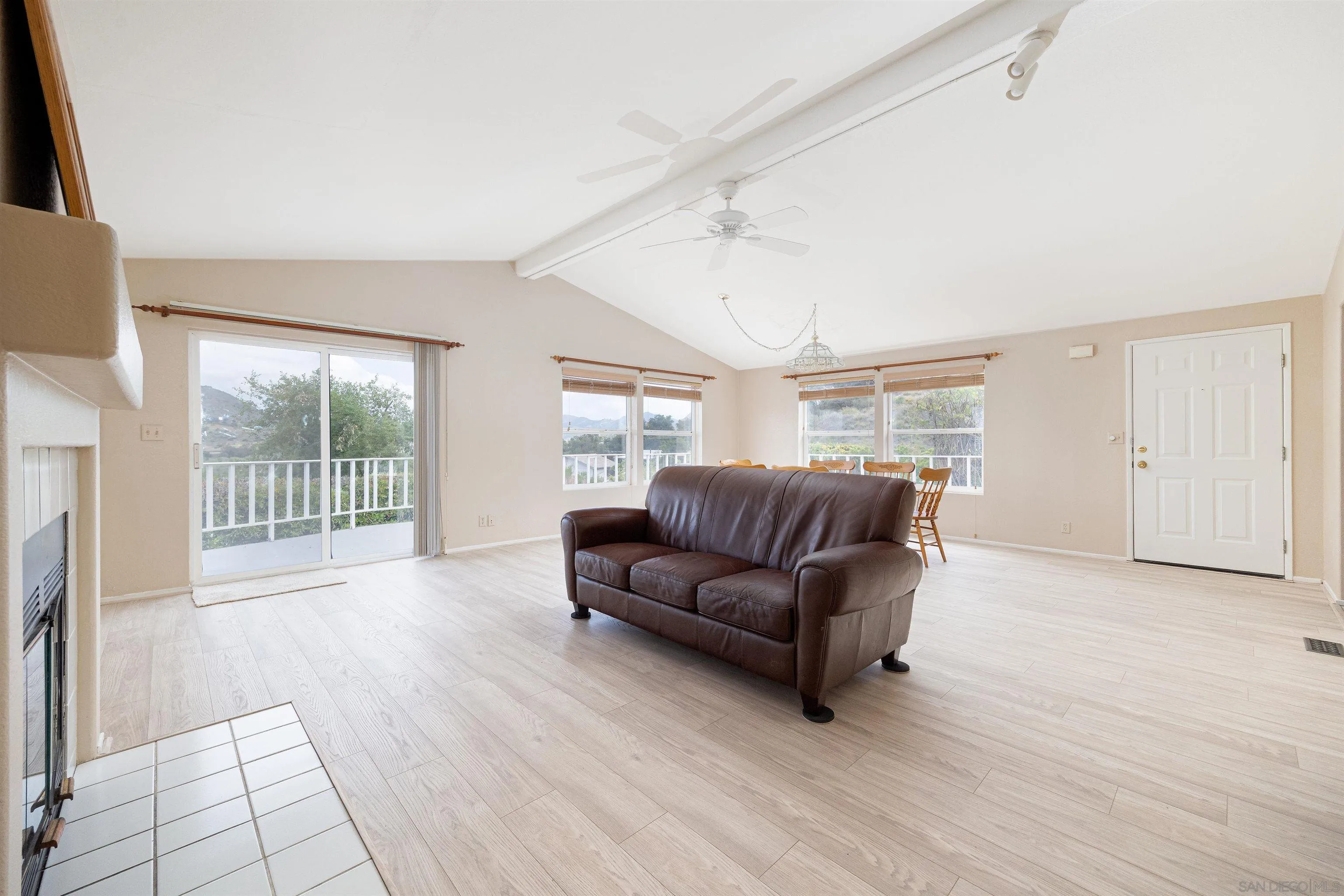 4650 Dulin Road, Unit 162 Fallbrook, CA 92003 - Photo 4 of 36 a living room with a couch and a floor to ceiling window