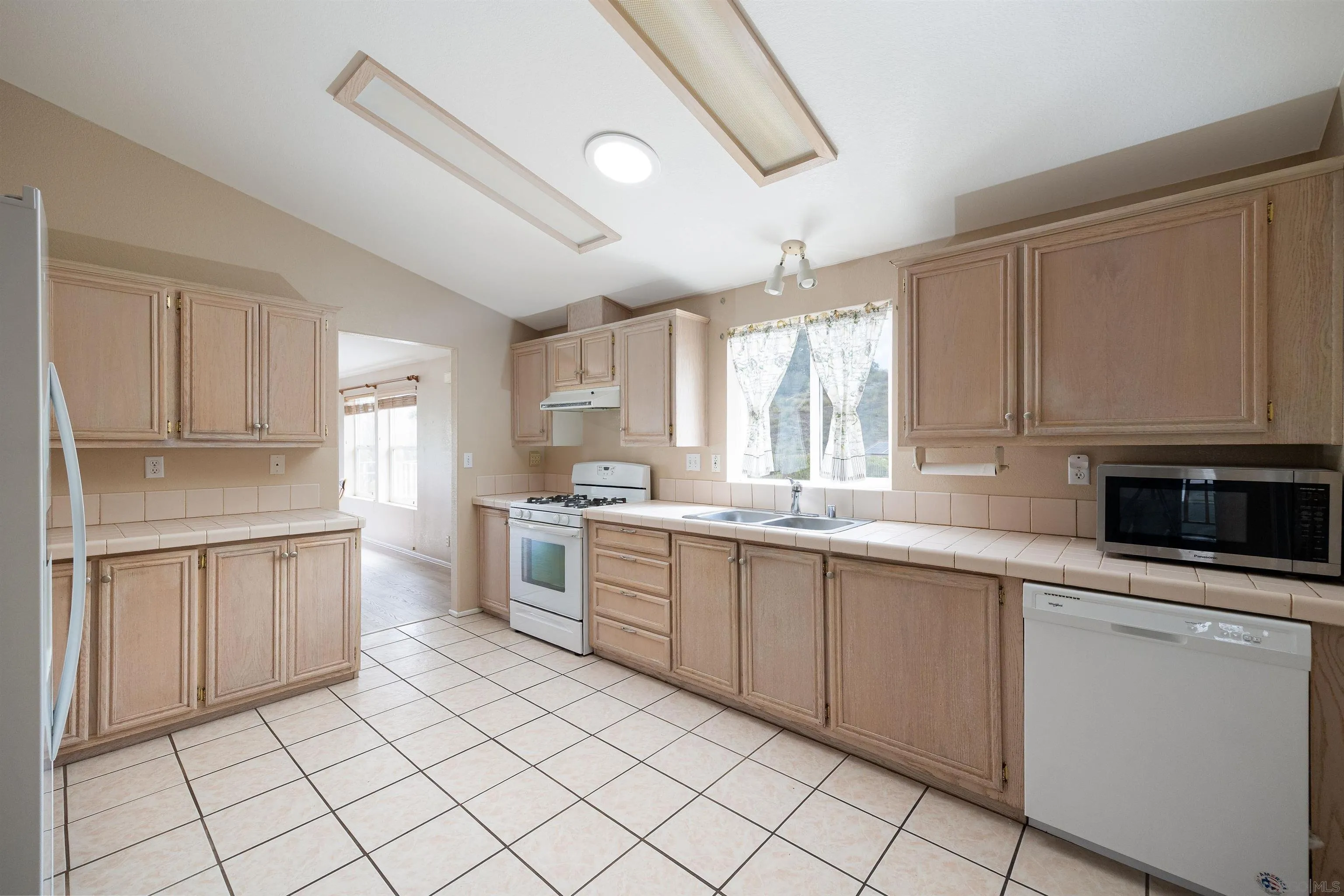 4650 Dulin Road, Unit 162 Fallbrook, CA 92003 - Photo 5 of 36 a kitchen with a sink and cabinets