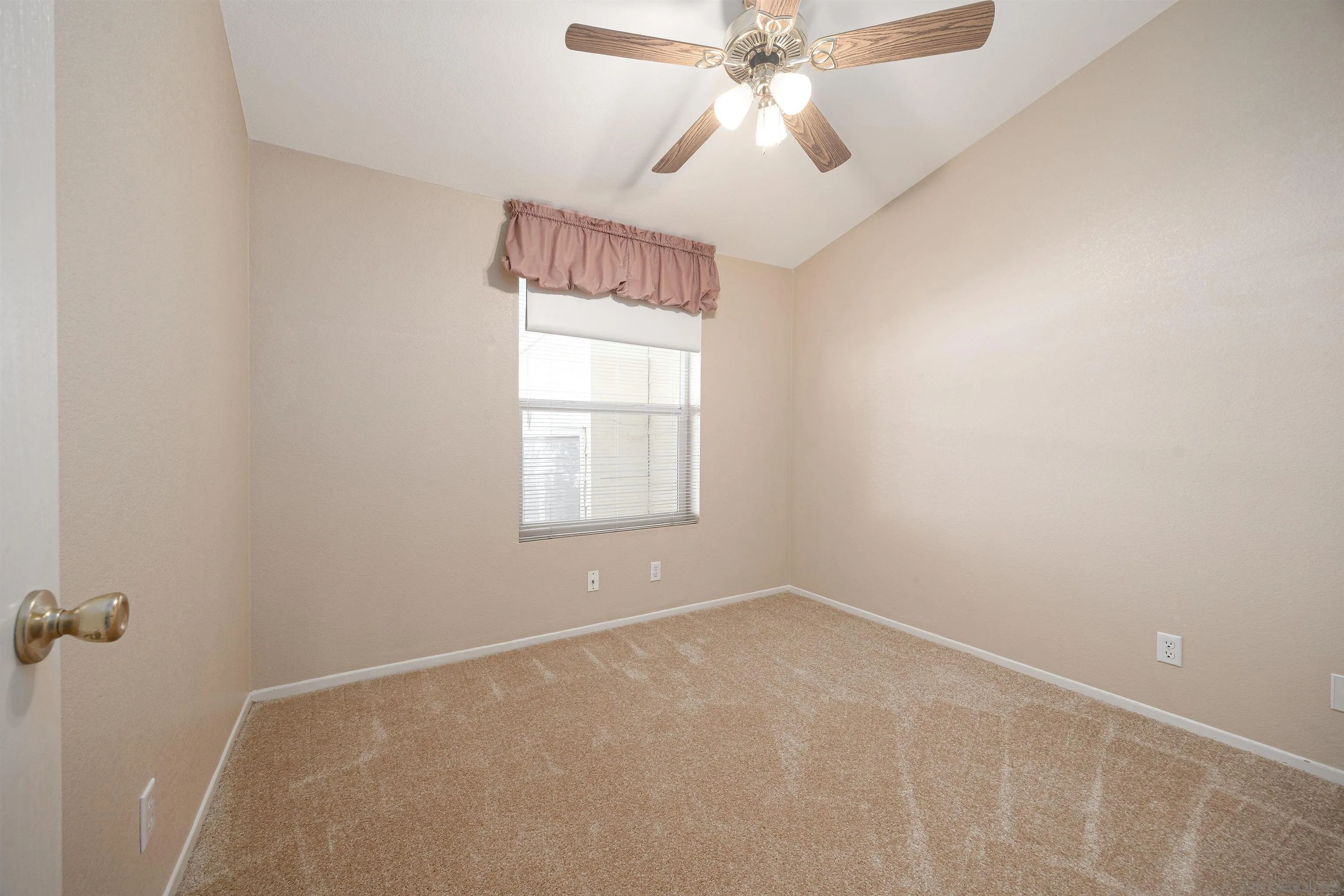 4650 Dulin Road, Unit 162 Fallbrook, CA 92003 - Photo 7 of 36 an empty room with windows and fan