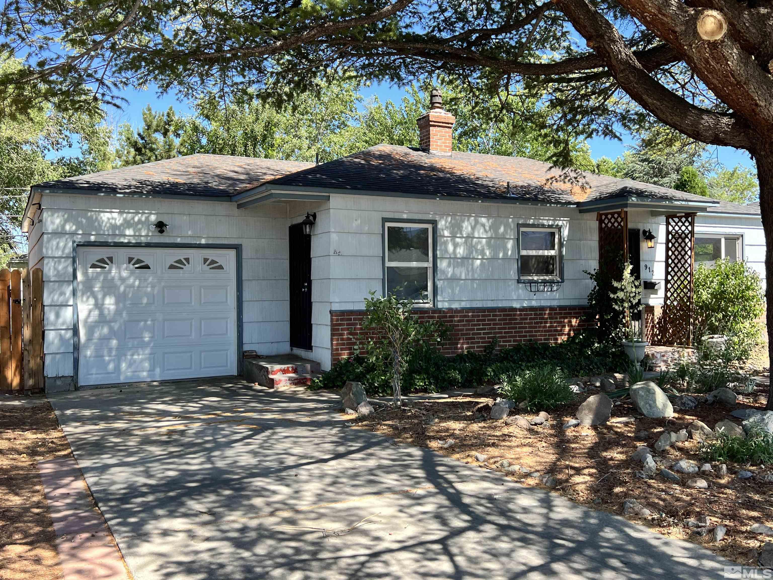 912 Bates Avenue Reno, NV 89502 - Photo 1 of 7 a front view of a house with a garden