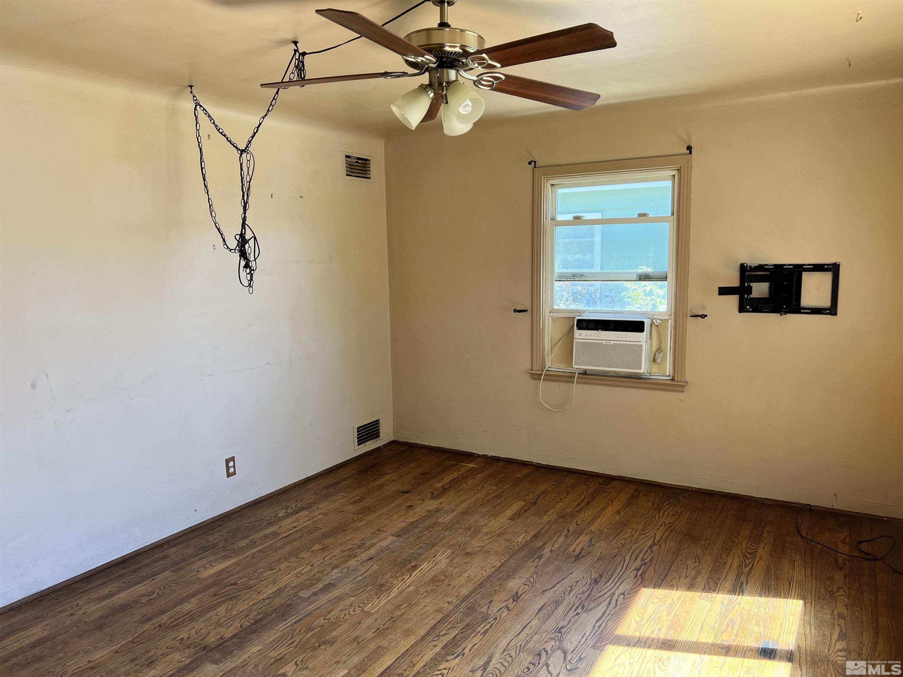 912 Bates Avenue Reno, NV 89502 - Photo 3 of 7 a room with a window and wooden floor