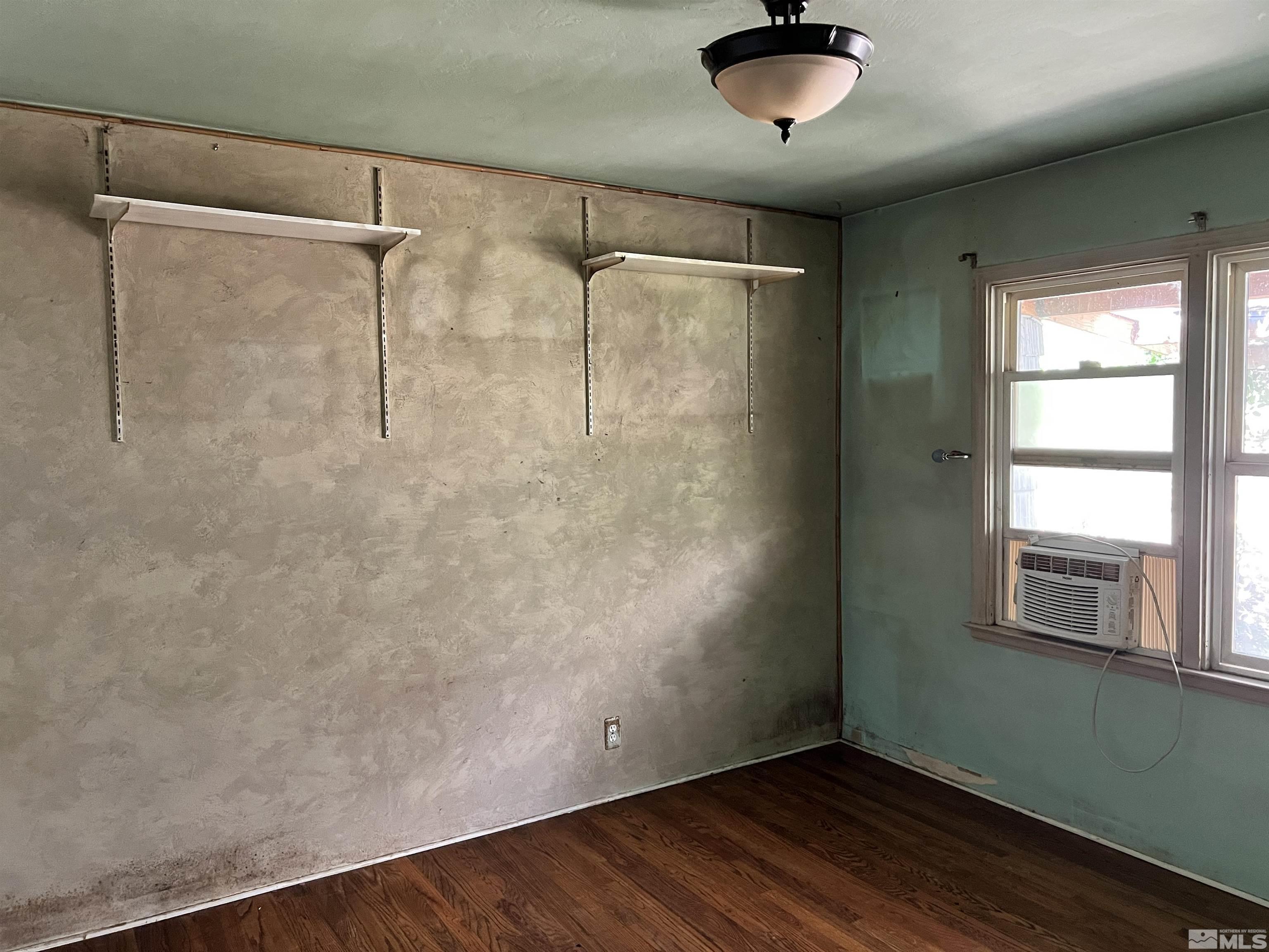 912 Bates Avenue Reno, NV 89502 - Photo 7 of 7 a room with wooden floor and windows