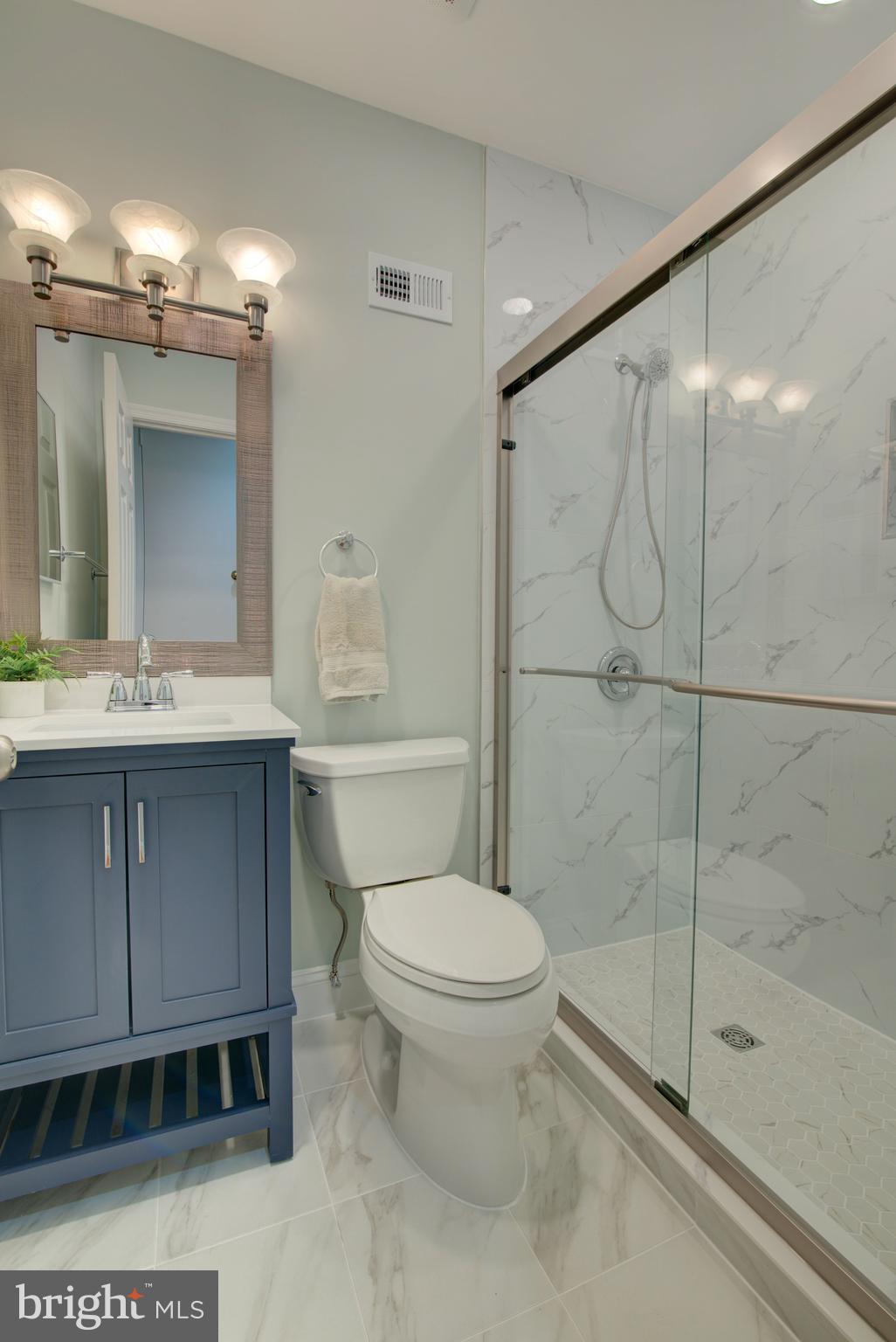 1953 Calvert Street Northwest, Unit D Washington, DC 20009 - Photo 21 of 27 a bathroom with a toilet a sink and shower
