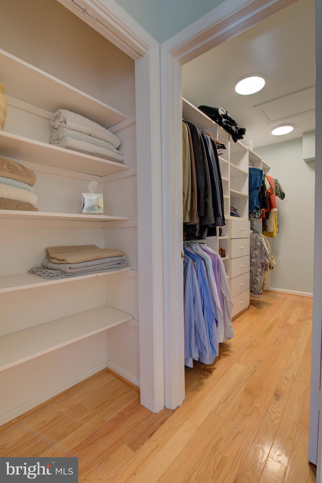1953 Calvert Street Northwest, Unit D Washington, DC 20009 - Photo 22 of 27 a view of walk in closet with clothes and shoes