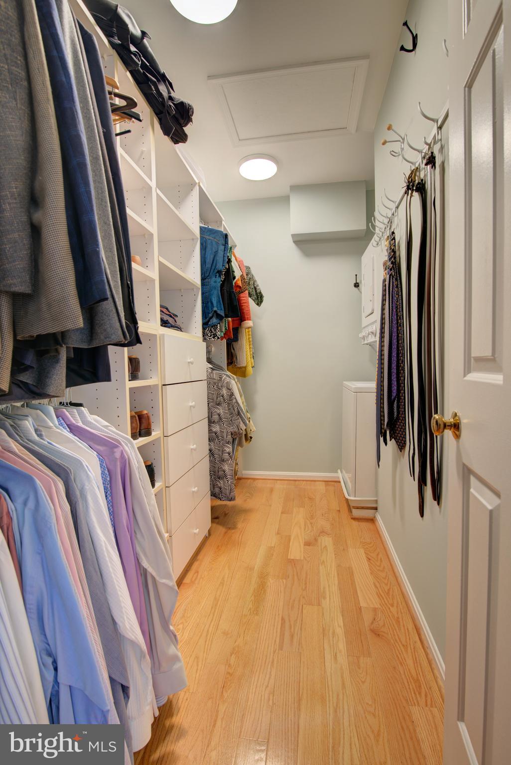 1953 Calvert Street Northwest, Unit D Washington, DC 20009 - Photo 23 of 27 a view of walk in closet with clothes and shoes