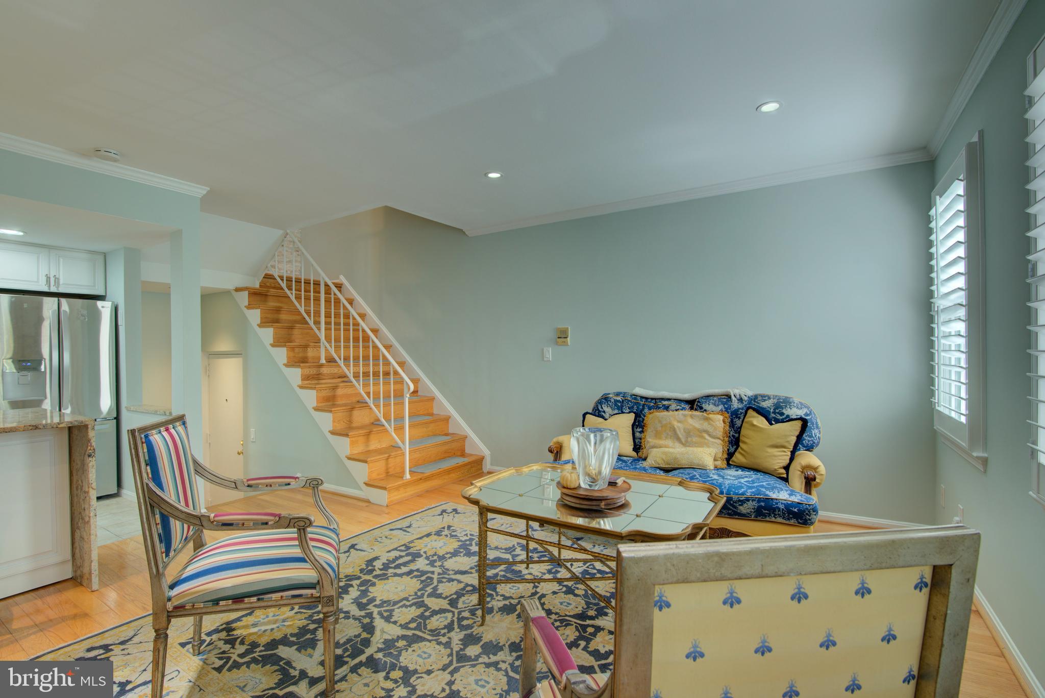 1953 Calvert Street Northwest, Unit D Washington, DC 20009 - Photo 10 of 27 a view of a room with furniture and wooden floor