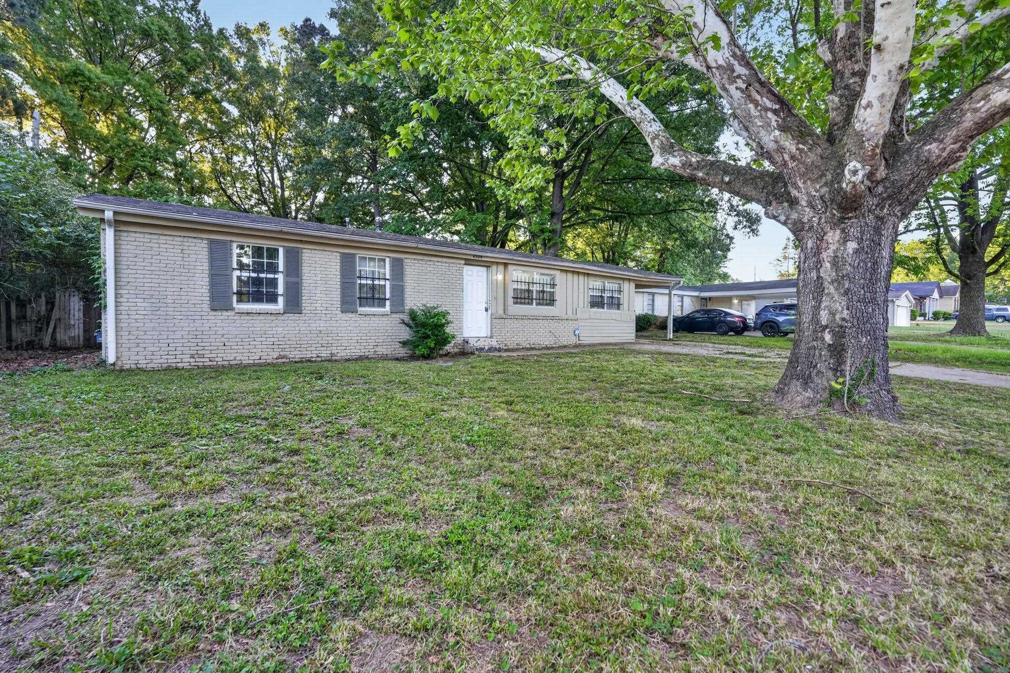 4504 Neely Road Memphis, TN 38109 - Photo 6 of 32 a house view with a garden space