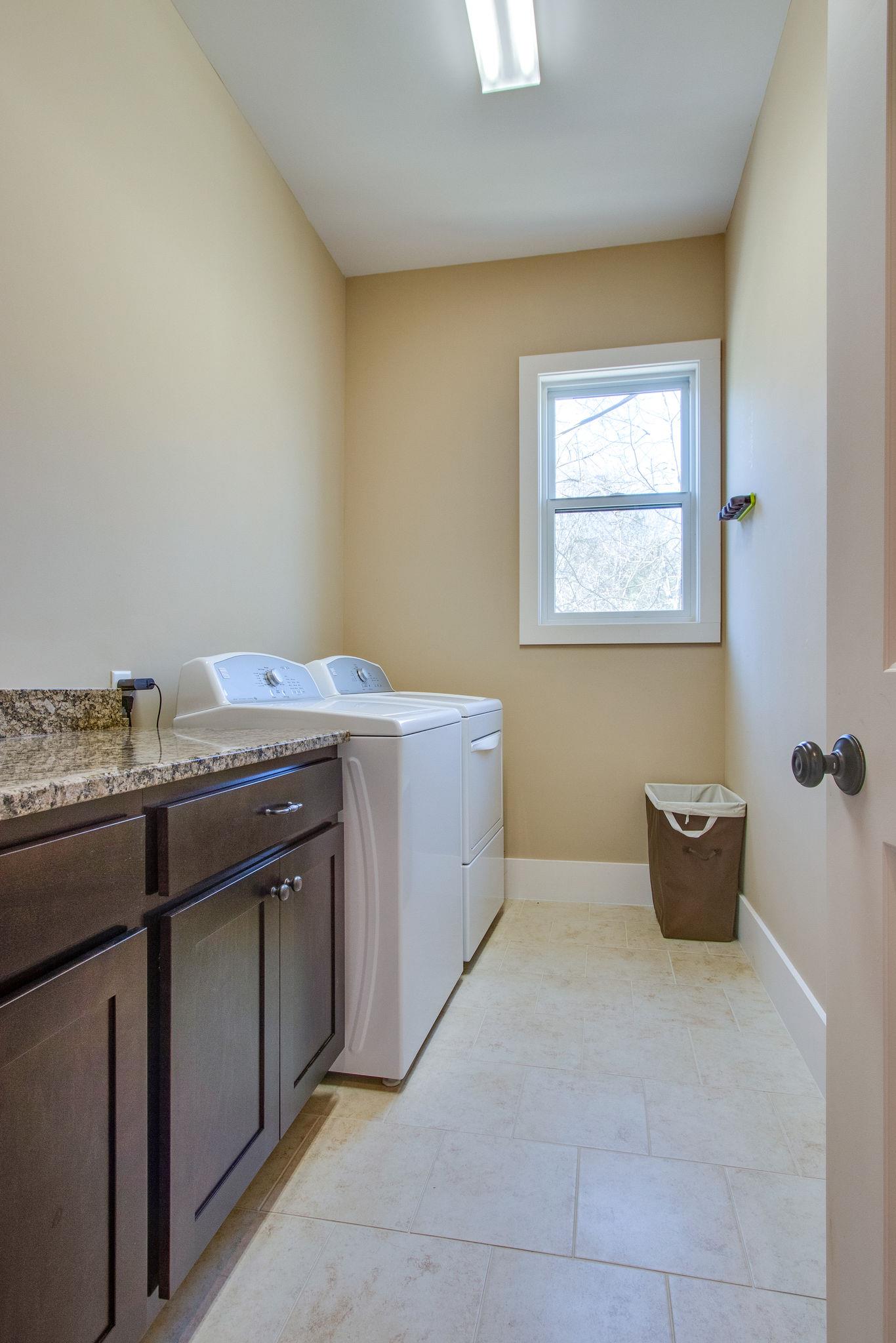 750 Floating Mill Village Road Silver Point, TN 38582 - Photo 15 of 30 a utility room with a washer dryer and potted plants