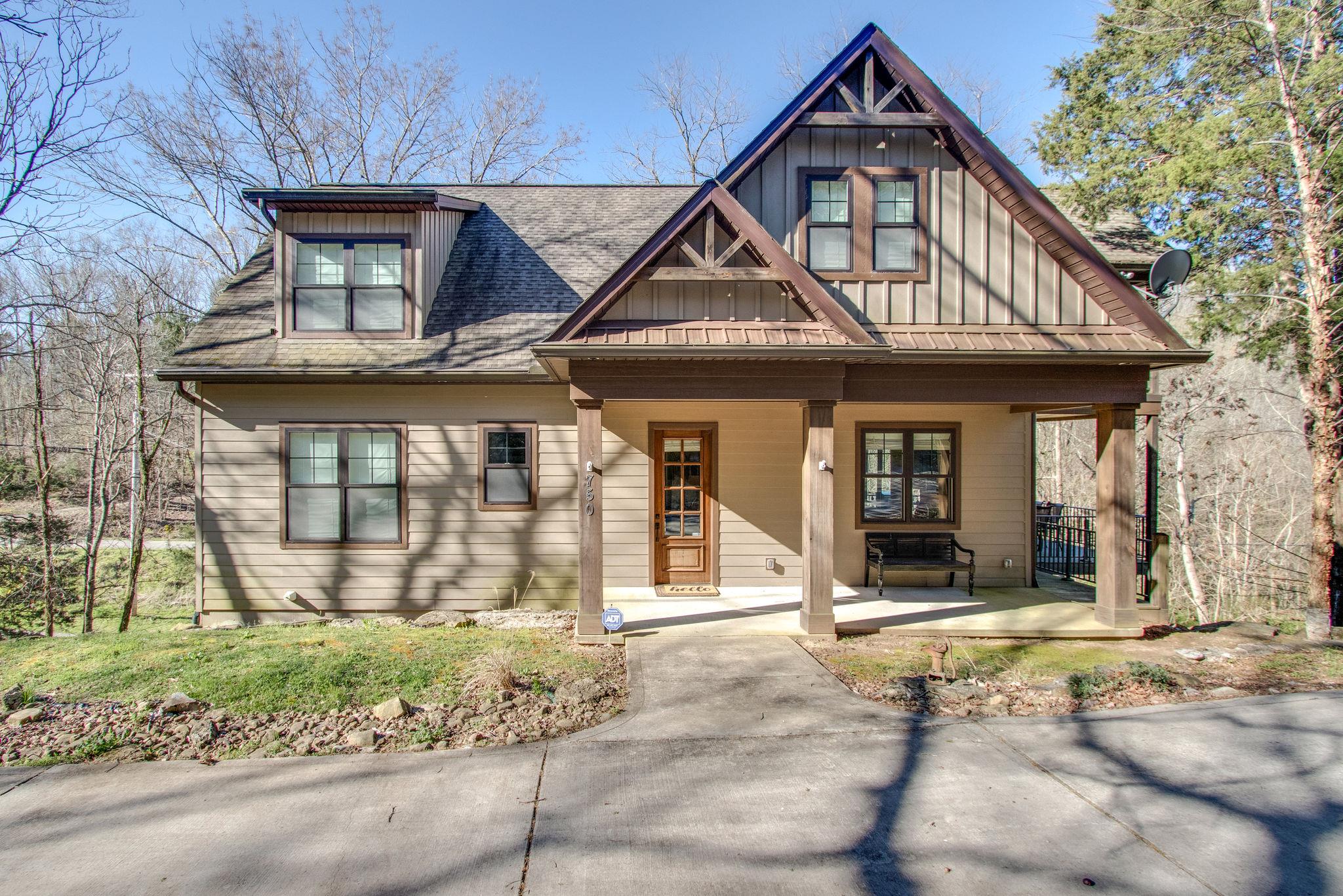 750 Floating Mill Village Road Silver Point, TN 38582 - Photo 2 of 30 a front view of a house with garden