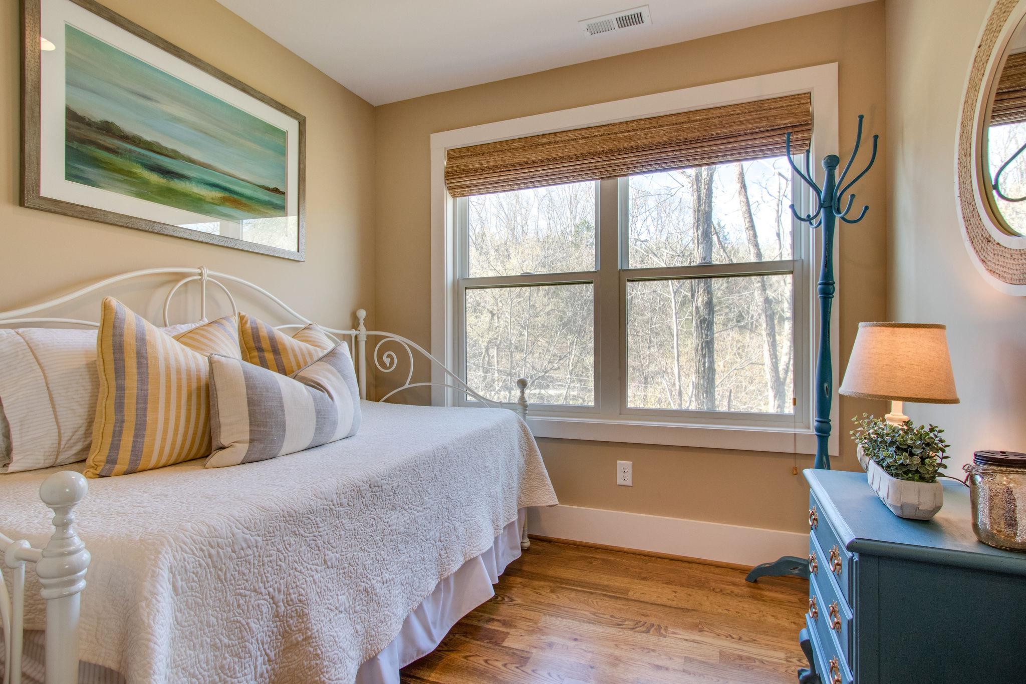 750 Floating Mill Village Road Silver Point, TN 38582 - Photo 21 of 30 a bedroom with a bed and a window