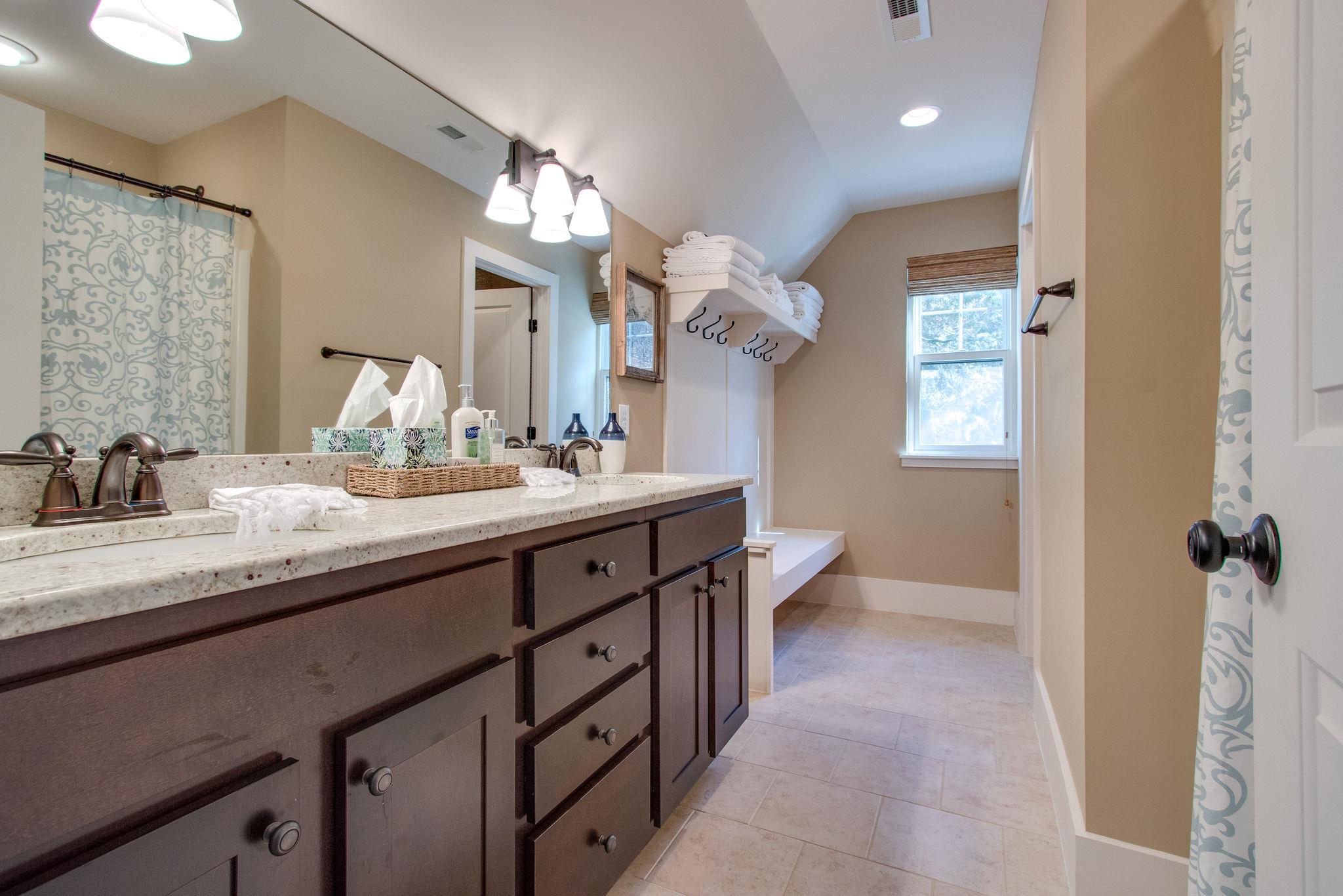 750 Floating Mill Village Road Silver Point, TN 38582 - Photo 22 of 30 a bathroom with a double vanity sink and a mirror