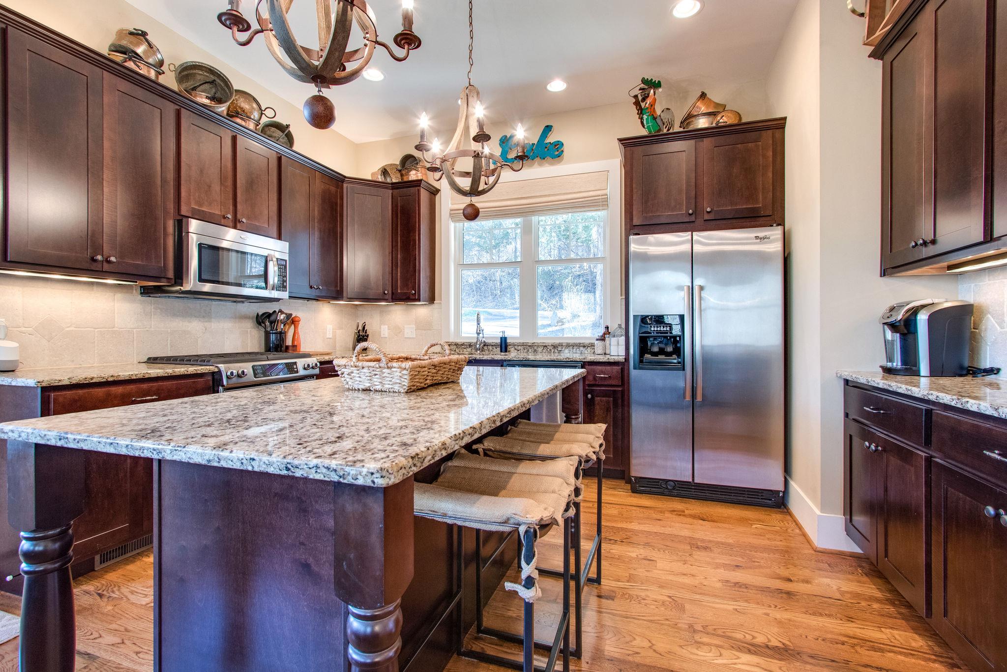750 Floating Mill Village Road Silver Point, TN 38582 - Photo 9 of 30 a kitchen with stainless steel appliances granite countertop a sink refrigerator and microwave