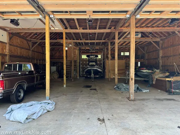 a view of a room with gym equipment and floor to ceiling window