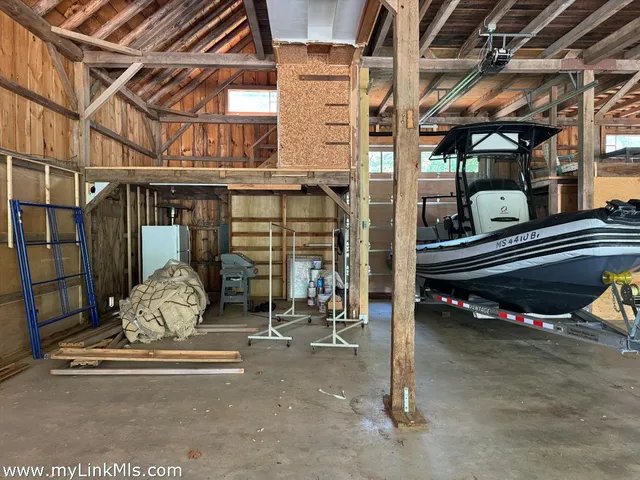 a view of a building with a door and wooden roof