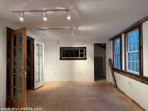 a kitchen with a stove a refrigerator and wooden cabinets