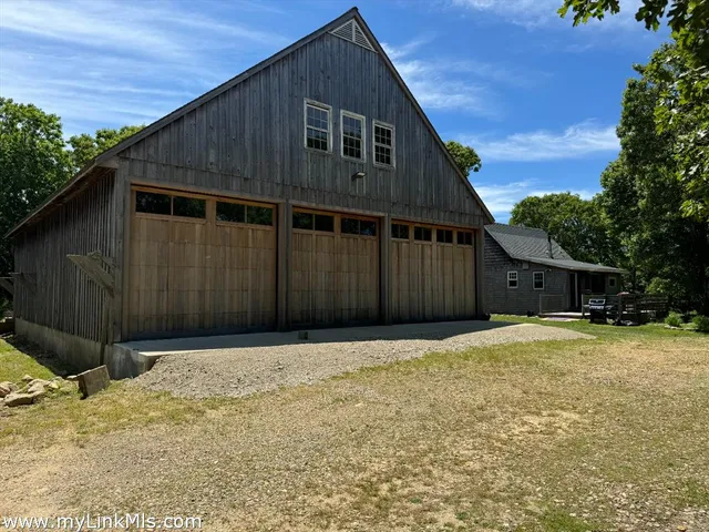 a house with trees in the background