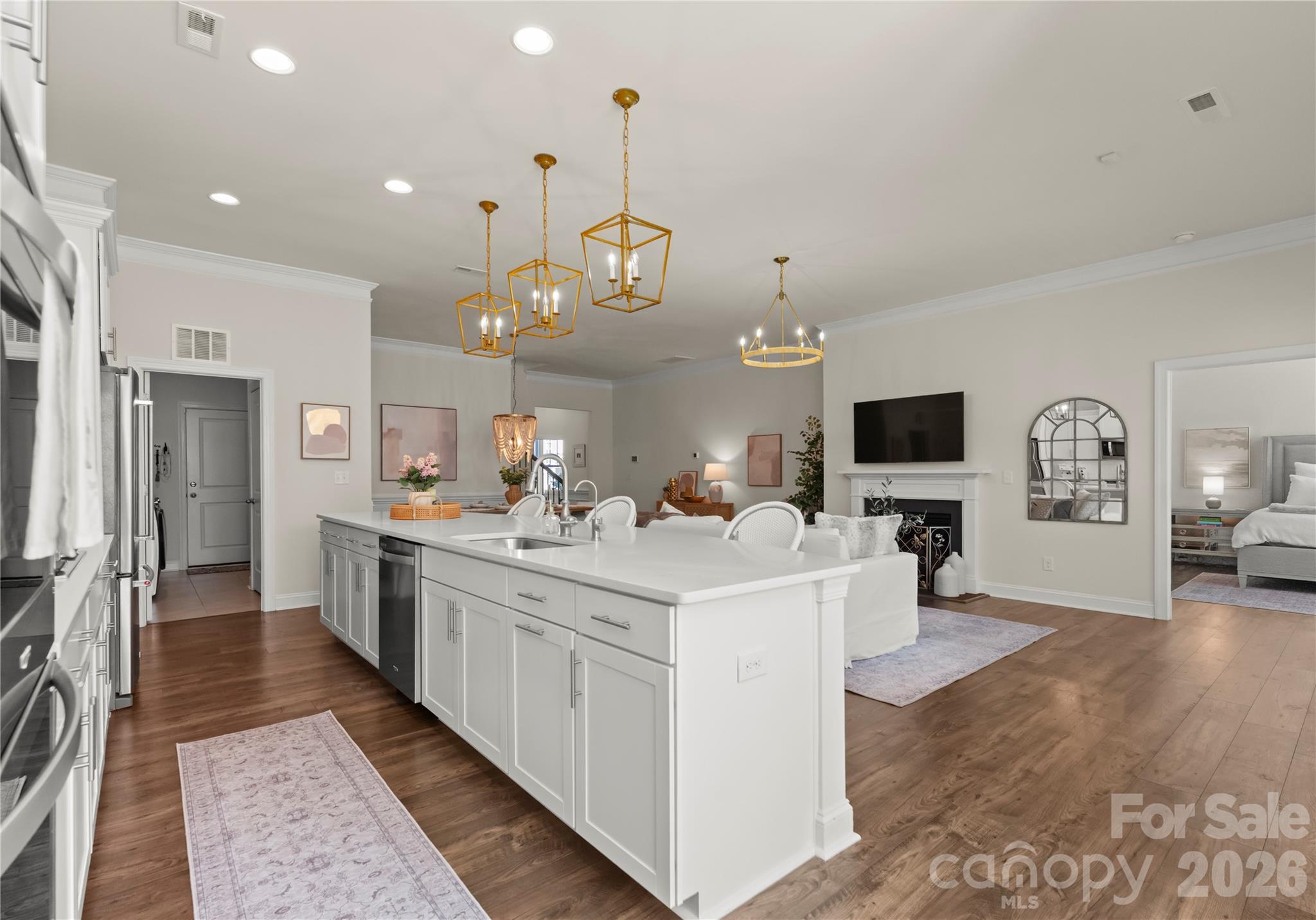 349 Preston Road Mooresville, NC 28117 - Photo 11 of 48 a large white kitchen with a stove a sink dishwasher and a refrigerator with wooden floor