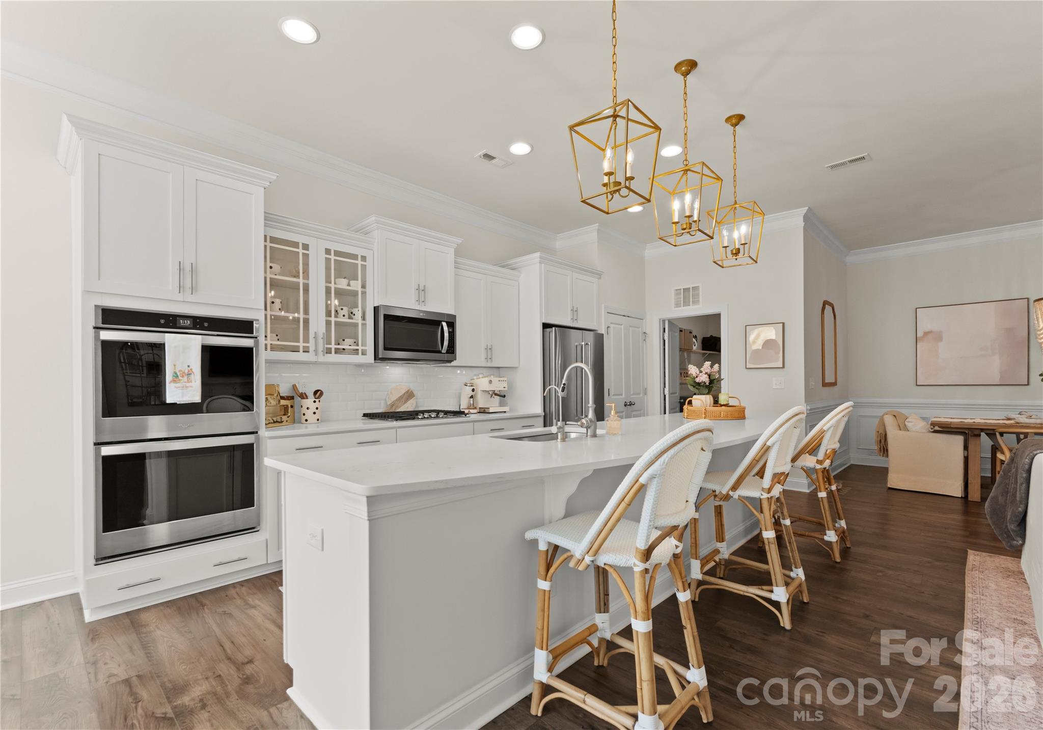 349 Preston Road Mooresville, NC 28117 - Photo 12 of 48 a view of a dining room with furniture and wooden floor