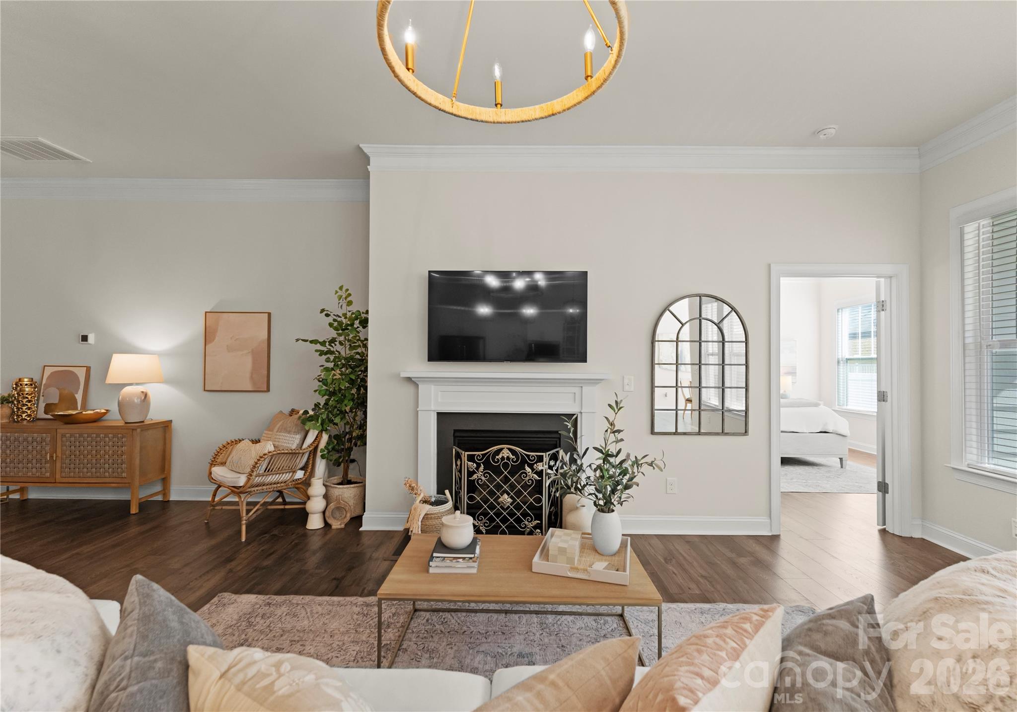 349 Preston Road Mooresville, NC 28117 - Photo 18 of 48 a living room with furniture a fireplace and a large mirror