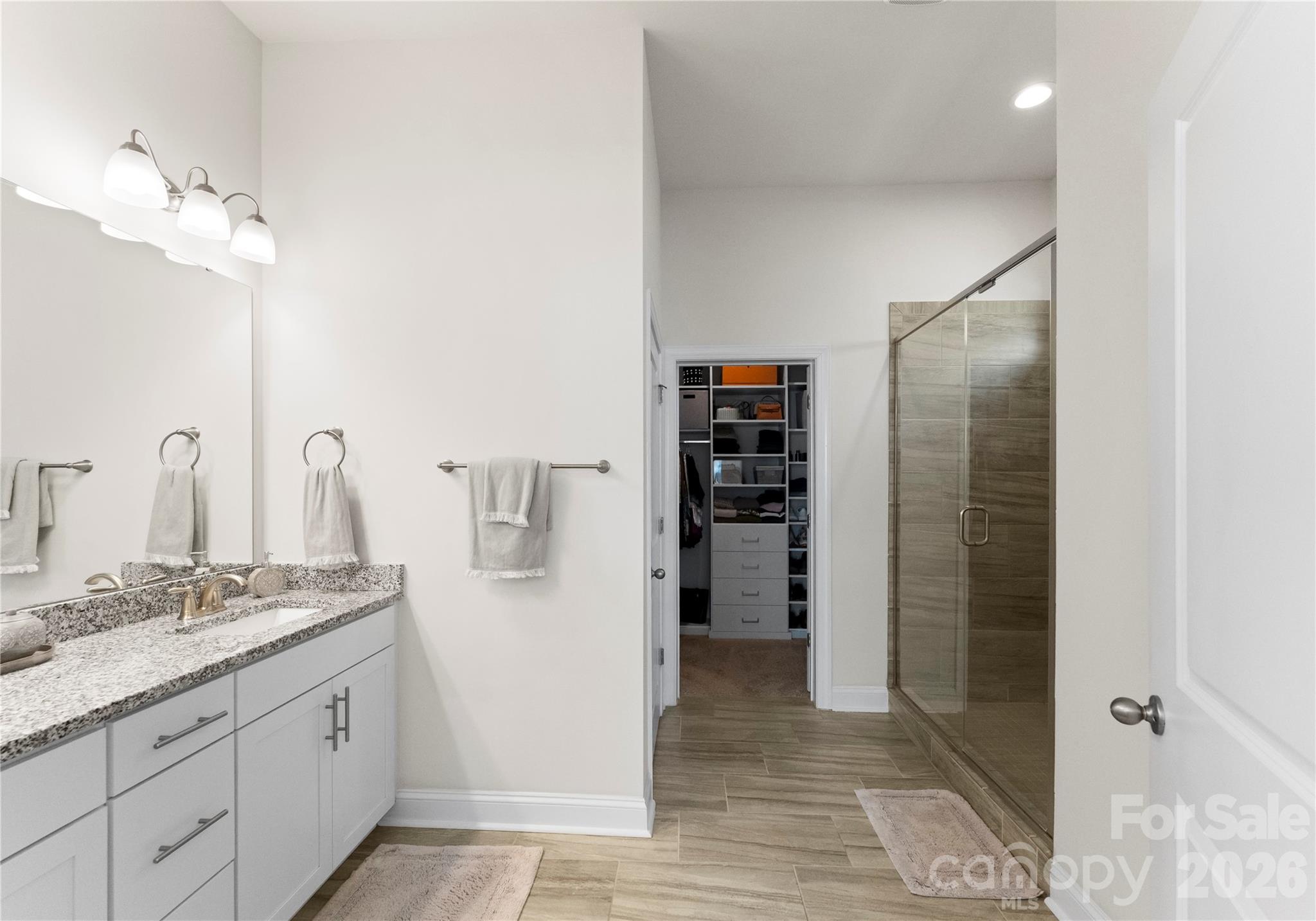 349 Preston Road Mooresville, NC 28117 - Photo 22 of 48 a bathroom with a granite countertop sink a toilet and shower