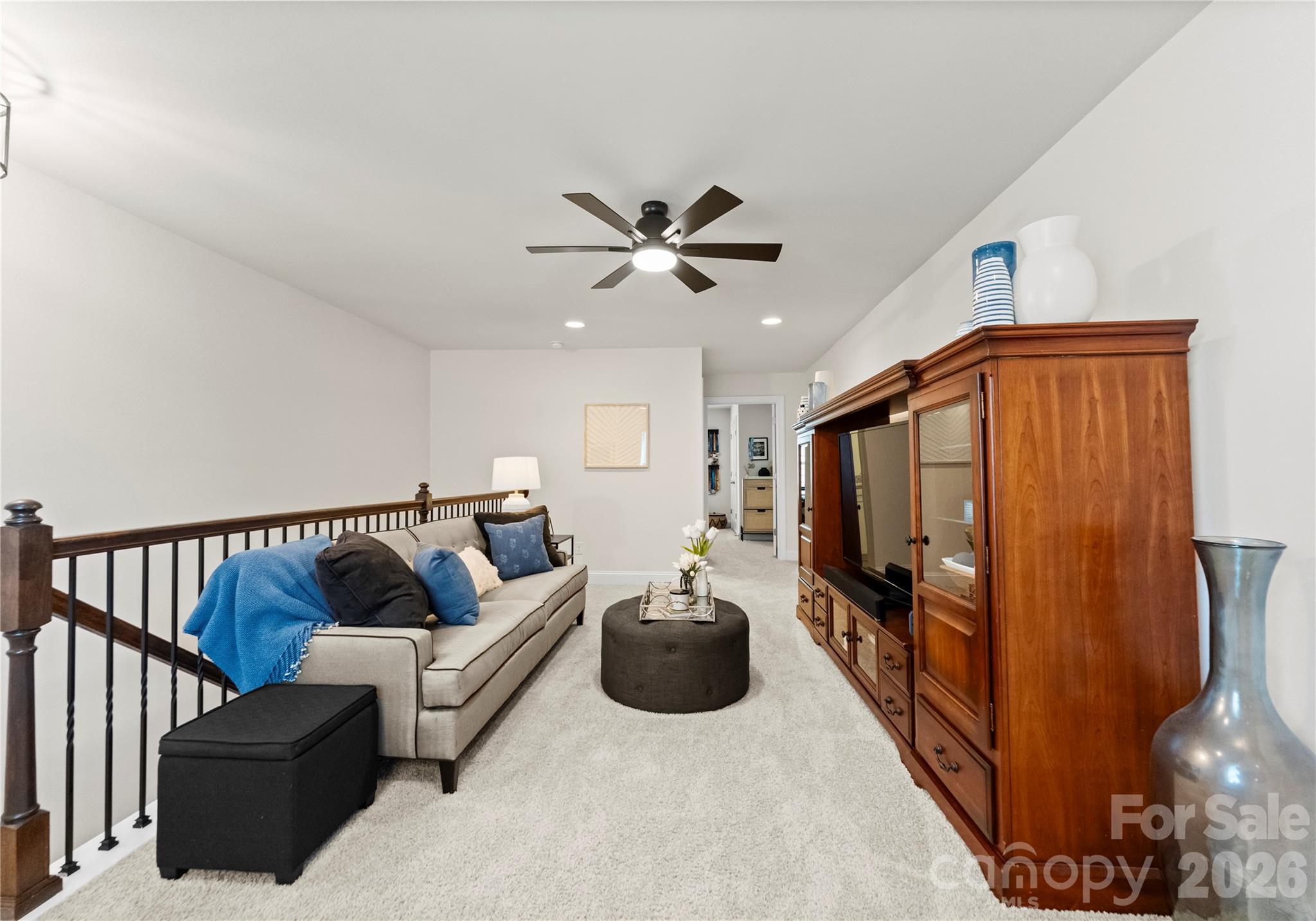 349 Preston Road Mooresville, NC 28117 - Photo 26 of 48 a living room with furniture ceiling fan and a rug
